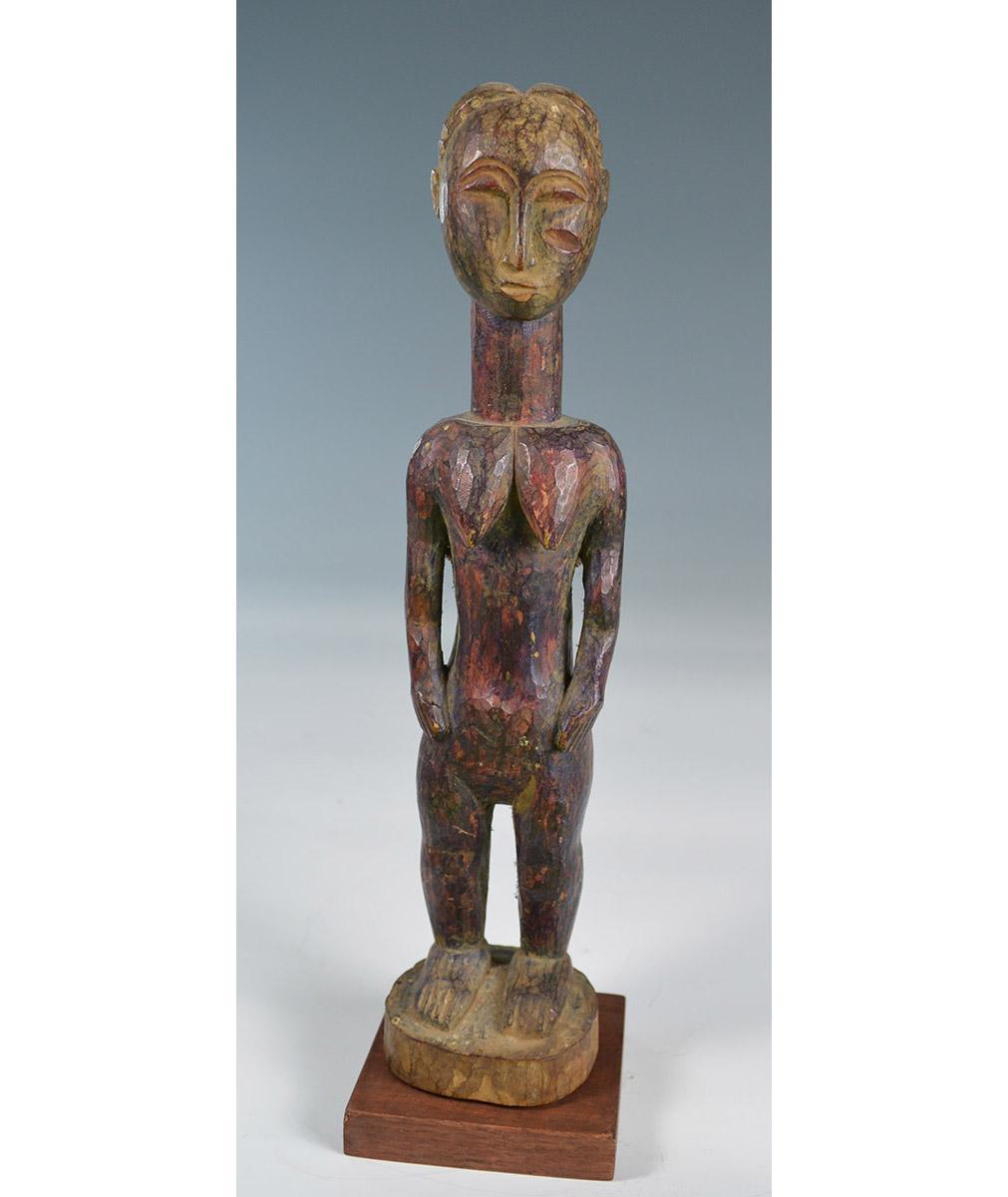 African Tribal art
A interesting Old Baule Baule Blo Bian female figure with purple dye surface 
Measures: Height 30 cm.
Period early 20th century 
Mounted on a base.
Provenance: Ex Fred Hanley collection UK, Ex French