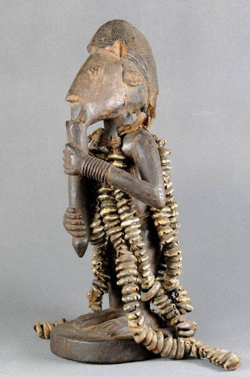 African tribal art

A fine Yoruba Eshu figure with cowrie shell decorations 
Eshu is the Embodiment of the principle of uncertainty in the Yoruba pantheon, He has the attributes of the magician, the trickster and is messenger to the Yoruba Orissa