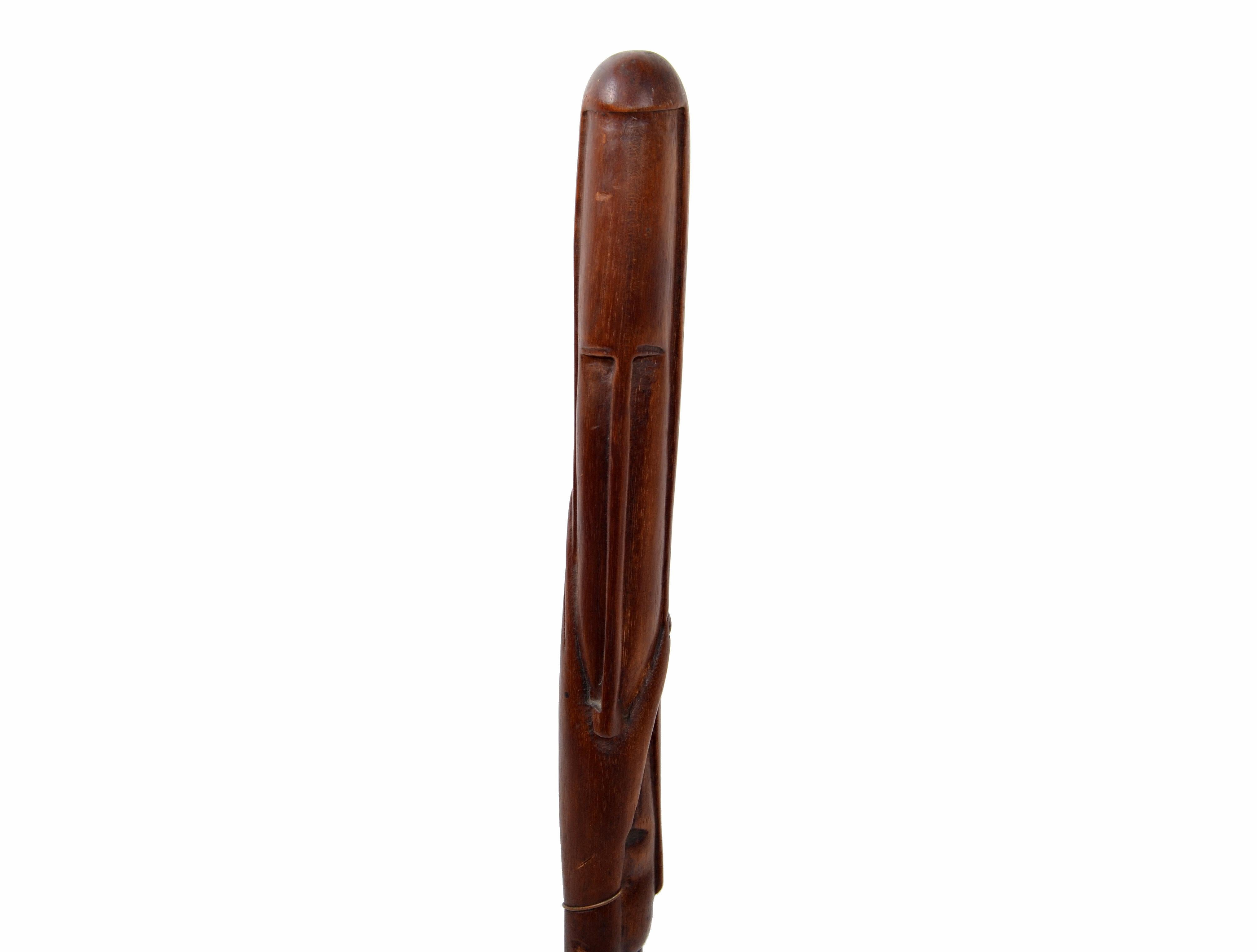 African tribal art hand carved mahogany wooden sculpture, decorative object.
Abstract figure on a wooden base.
Measure of the mahogany piece alone is 23.5 inches.