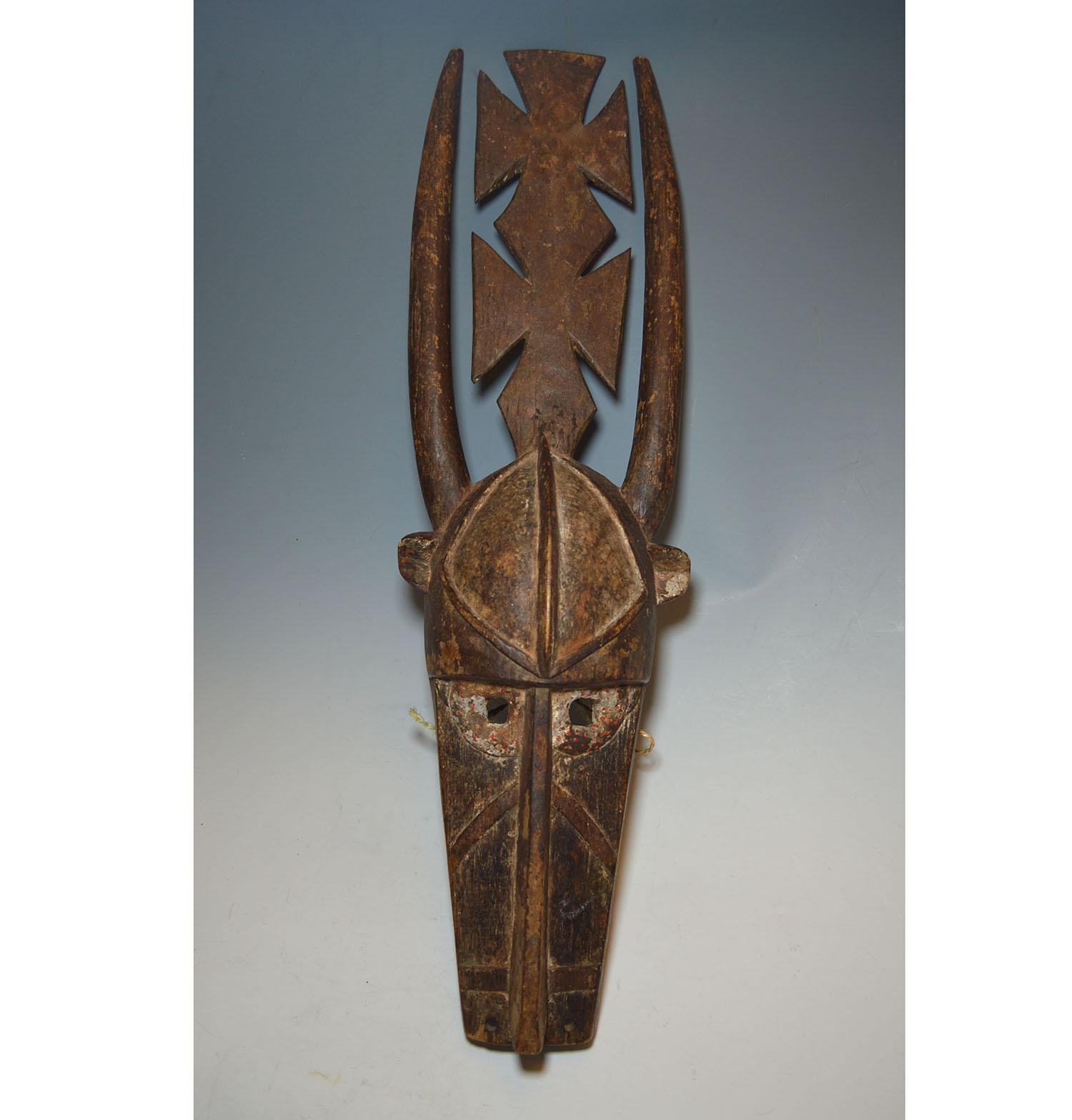 African Tribal Art impressive large old Mossi antelope mask

This is splendid very impressive Mossi antelope mask from Burkina Faso, a very large mask with cubist style facial features with large horns rising from the top. Remains of original