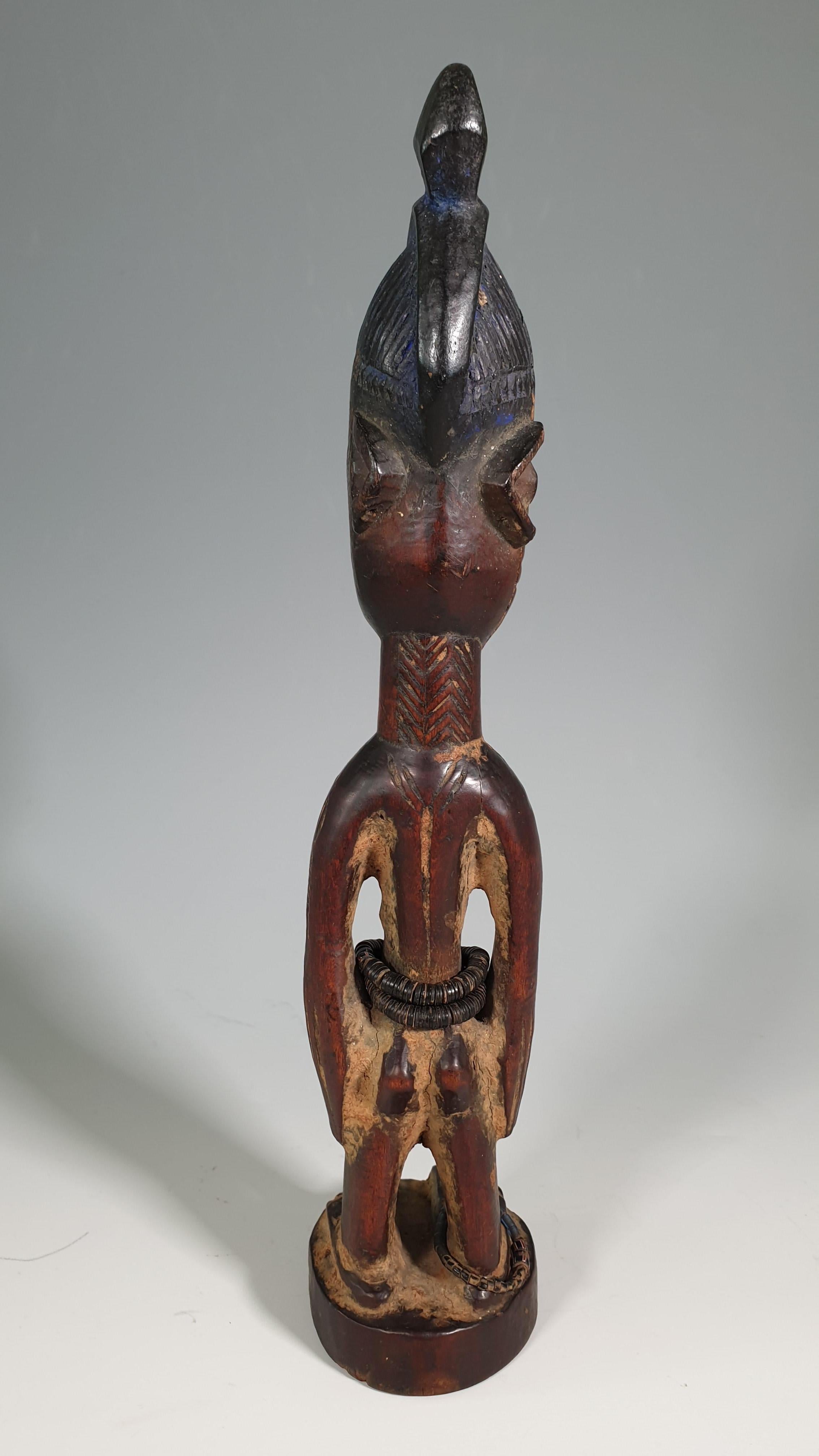 African tribal fine very rare Yoruba Ibeji figure Efon Alaye
A finely carved rare female Ibeji figure from the Efon Alaye region of Nigeria
Standing upright with arms at side with bulging eyes, dark brown patina, the chevron crown painted with