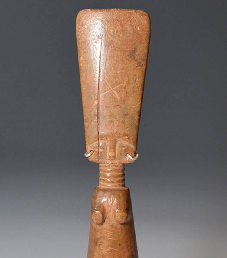 African tribal,

A Fanti fertility figure, 

The female fertility doll with typical ribbed neck and elongated head, honey colored patina with beads and metal earrings,
The Fanti people of Ghana use these figures in a variety of different contexts ,