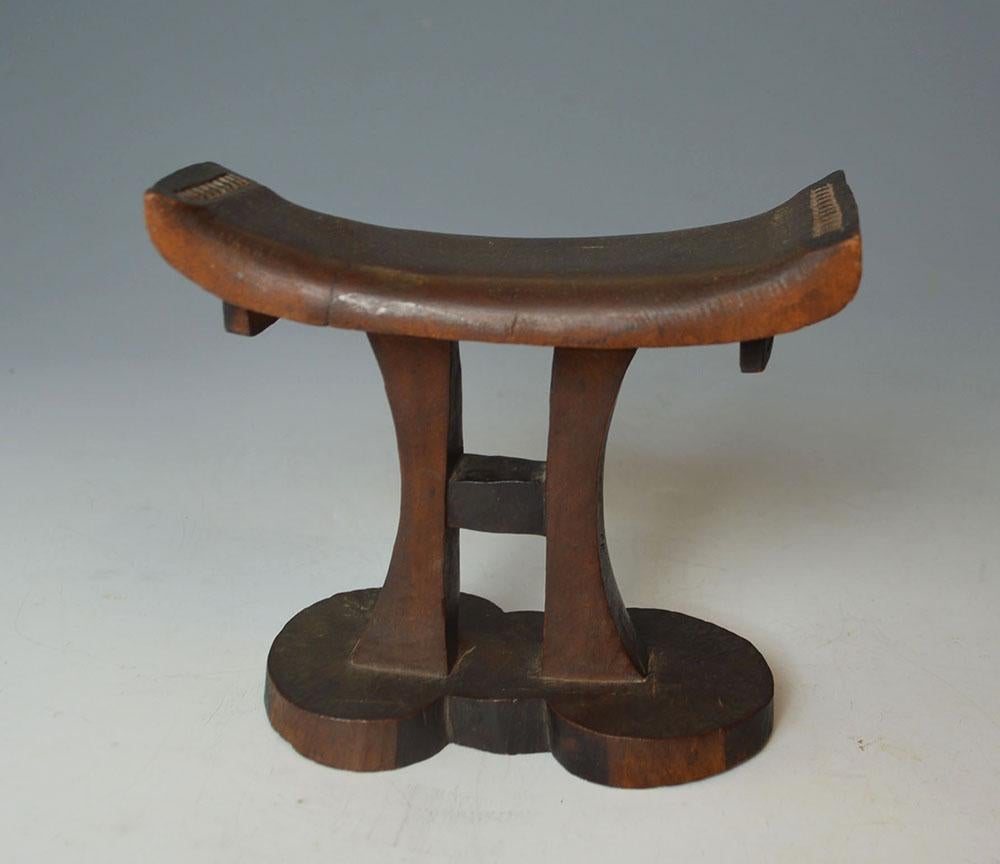 A fine Tsonga headrest South Africa,
Raised on 2 central pillars in H-form, carved in dense hard wood
This type of Headrest is of a style only made by the Tsonga people.
This elegant Tsonga headrest is carved from a single piece of very hard wood