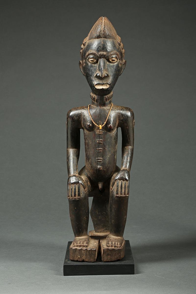 Offered by Scott McCue
African tribal seated Baule male figure, Ivory Coast, Africa

A finely carved seated Baule male figure with hands on knees. Open eyed expressive look with fine details and carefully carved hair. Seated on connected wood