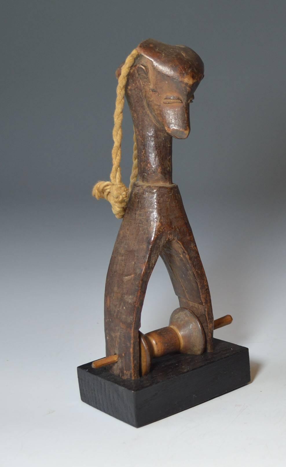 A fine Senufo heddle pulley
A antelope loom head pulley, these small pulleys are used for weaving strips of material which are sewn together into large cloths
Ex Hans Schleger collection acquired Sotheby’s, 1968
Senufo Ivory Coast
Period early