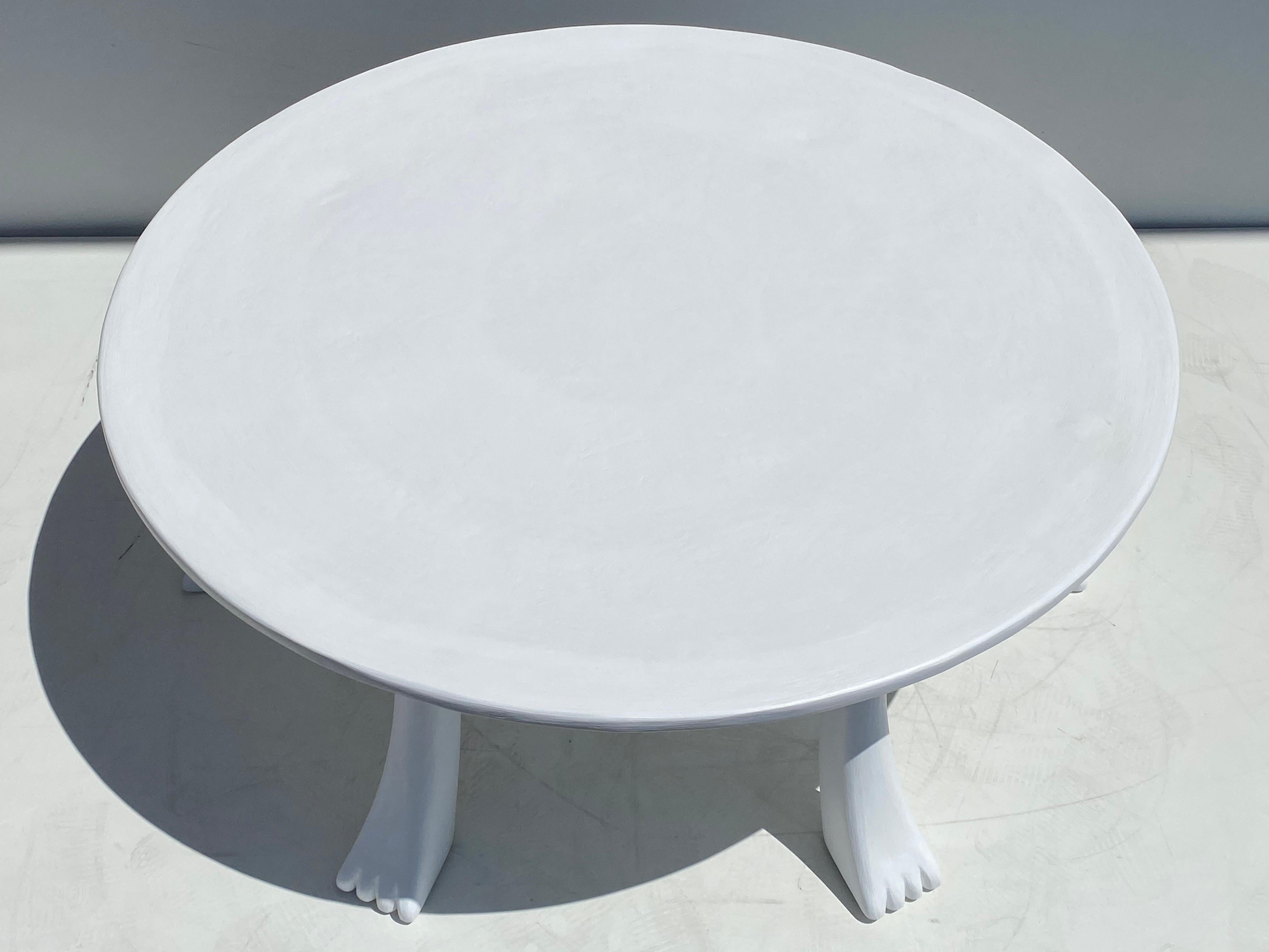 African tribal coffee table in wood covered with plaster in the style of John Dickinson.