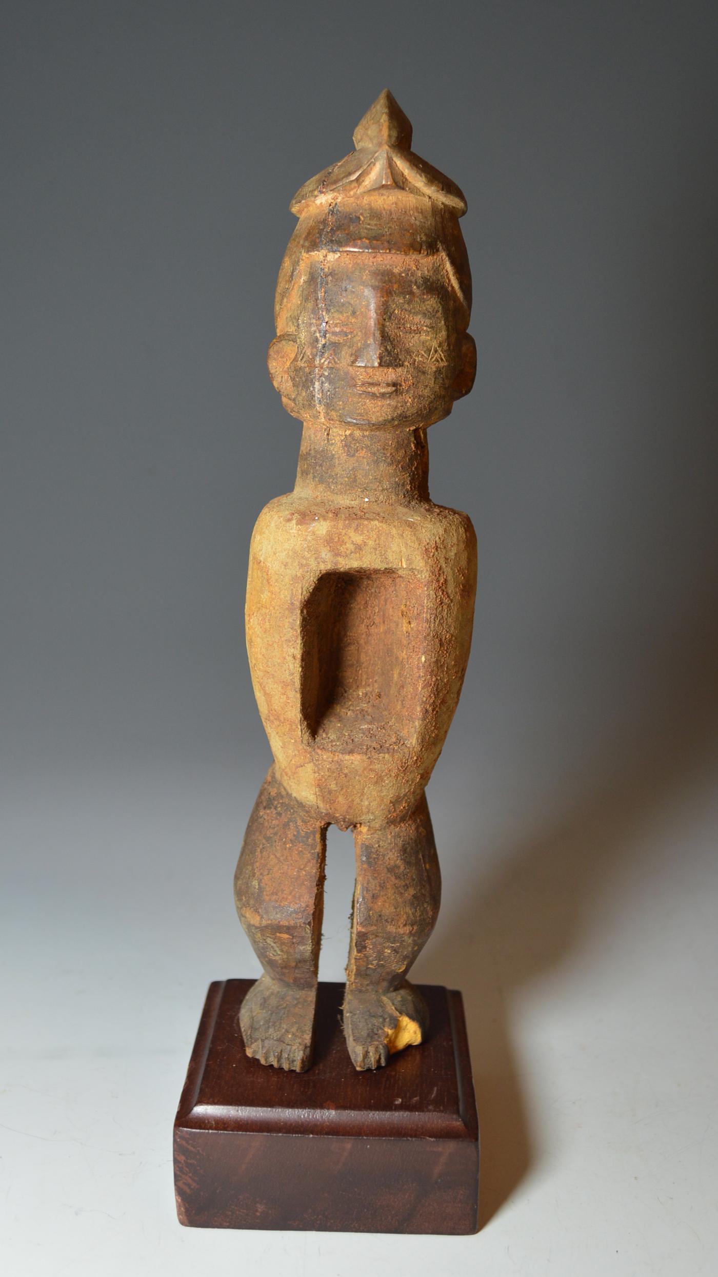 This is a fine Teke Mutinu Bamba magic figure,
The Teke use this type of cylindrical bodied figure to assist women during pregnancy, the magic material (bilongo) is often removed when a figure is seen to be effective and used to make other