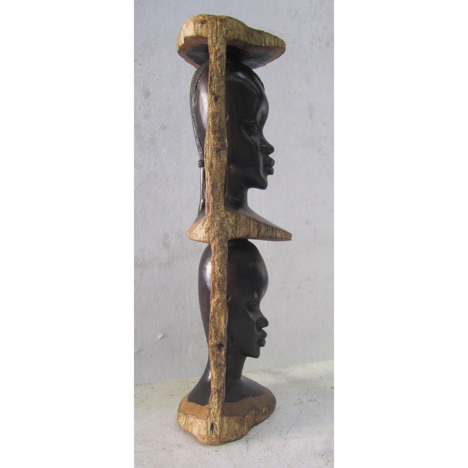This folk TOTEM pole sculpture is very finely carved in one chunk of ebony. A beautiful African piece that will be the focal point of your living space.