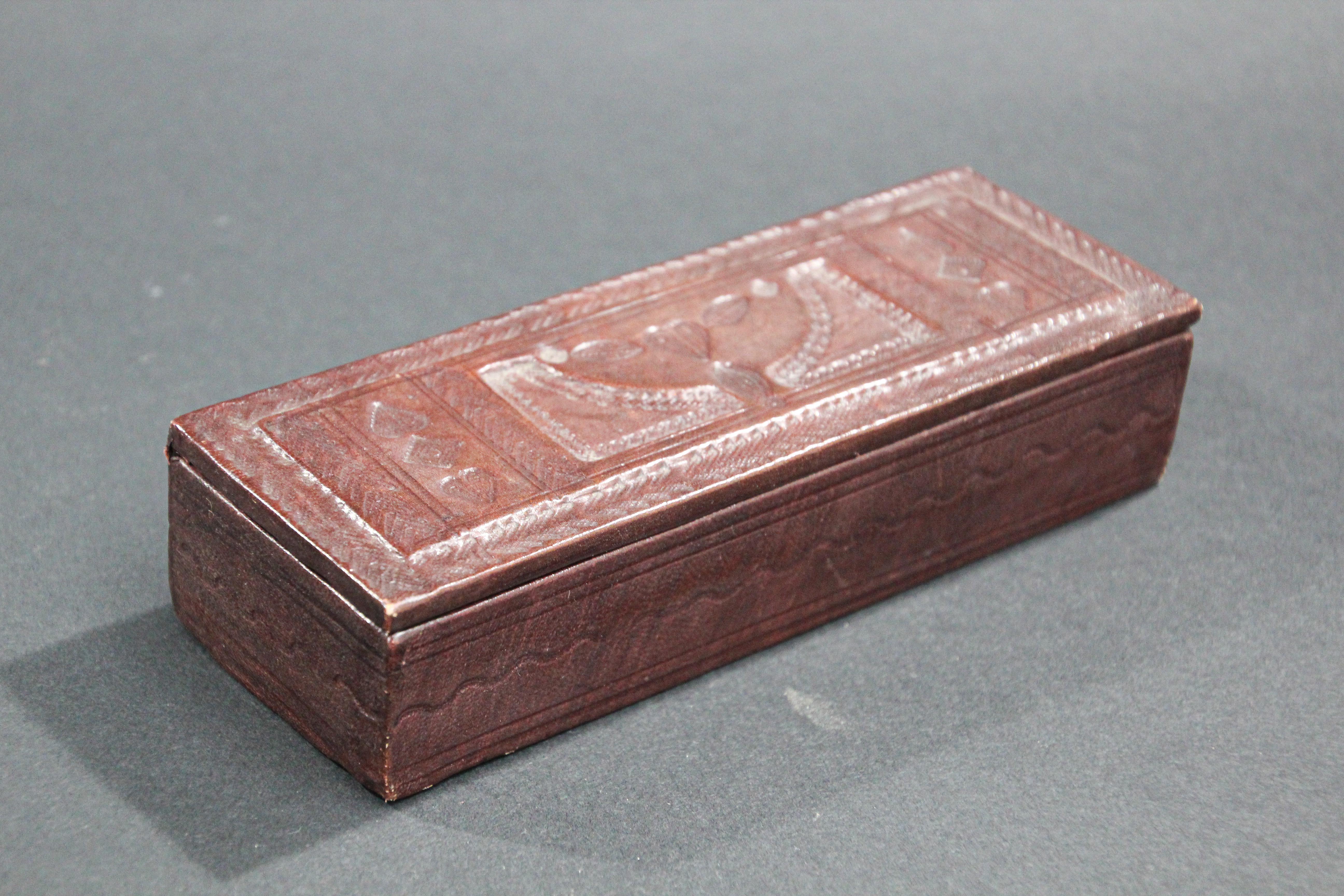 Hand tooled brown leather box from Africa.
Very fine workmanship with tribal traditional West African symbols on leather.
Tuareg style probably Mauritania.
Open to a leather lined interior.
Dimensions: 7.5
