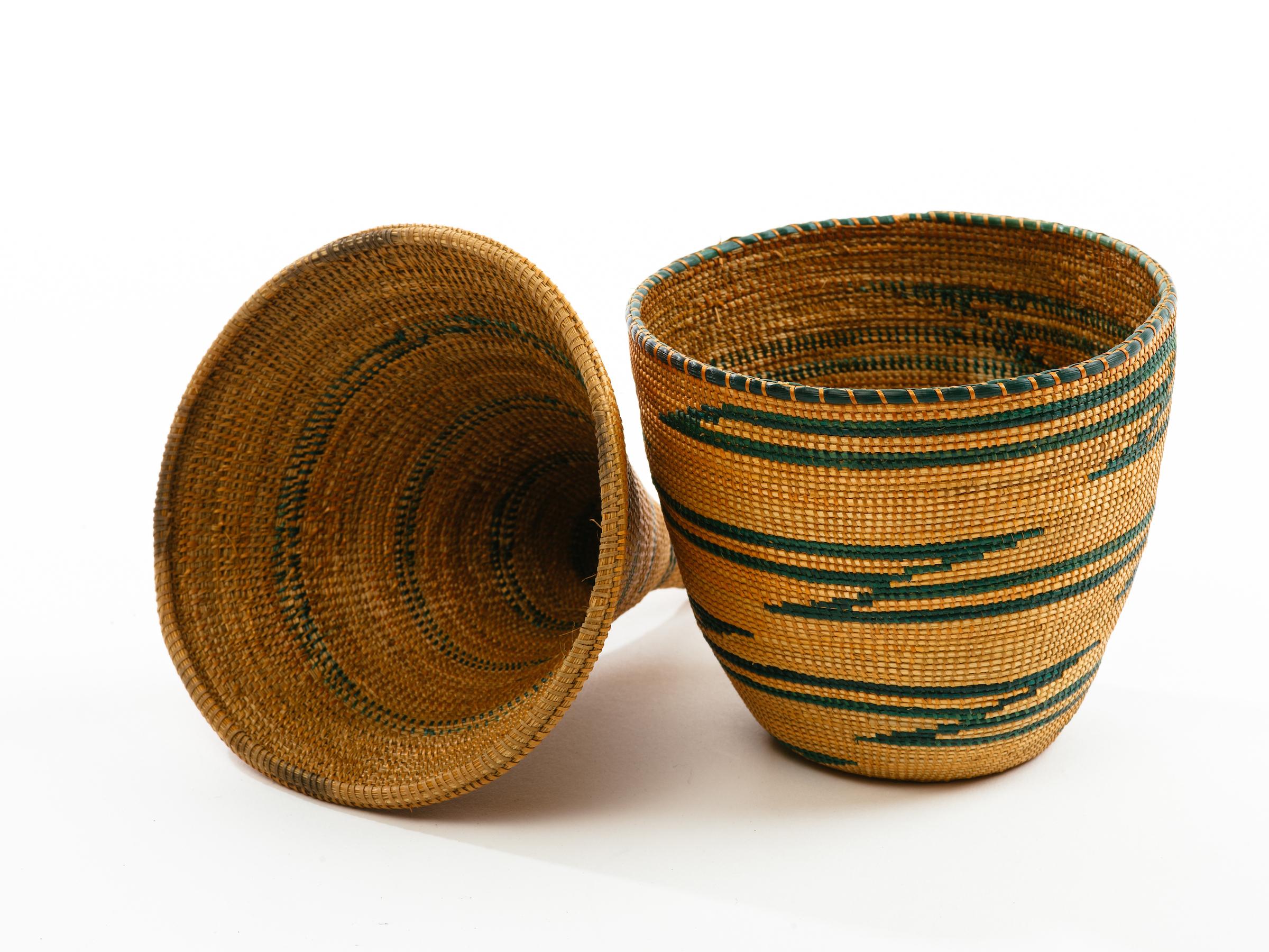Traditional Tutsi tribal presentation basket with conical lid. Finely woven of natural grasses, circa early to mid-20th century, Rwanda.