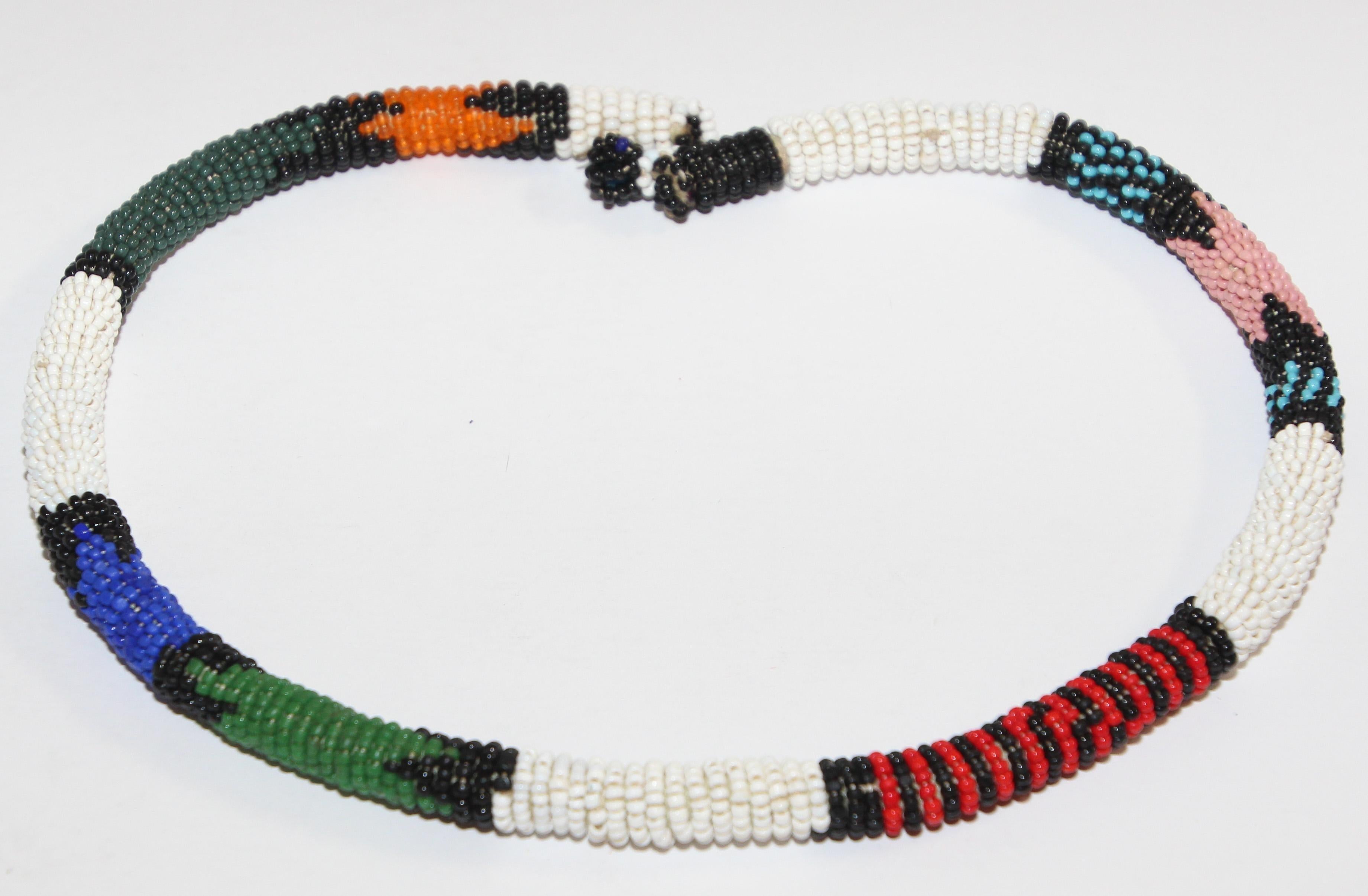 Vintage African Urembo beaded necklace choker. Handmade in Kenya by the maasai tribe. Urembo means ‚Äúbeauty‚Äù and the handmade pattern and unique color pairings will make a bold statement. Size 21 L x 0.25 D.
