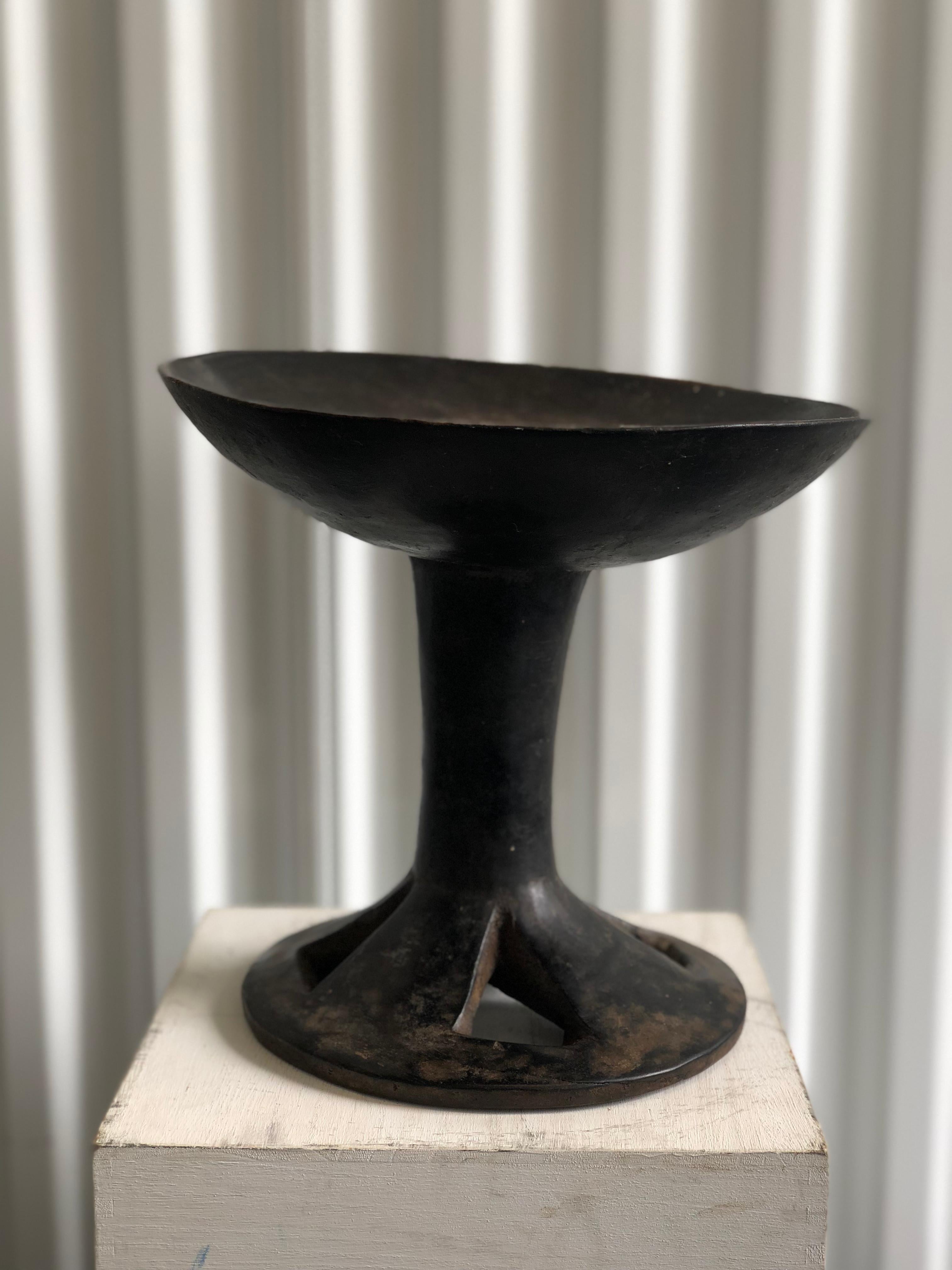 African wooden carved pedestal bowl

Diameter of bowl is 12