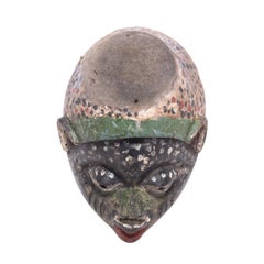 Copricapo africano Yoruba dipinto in Gelede