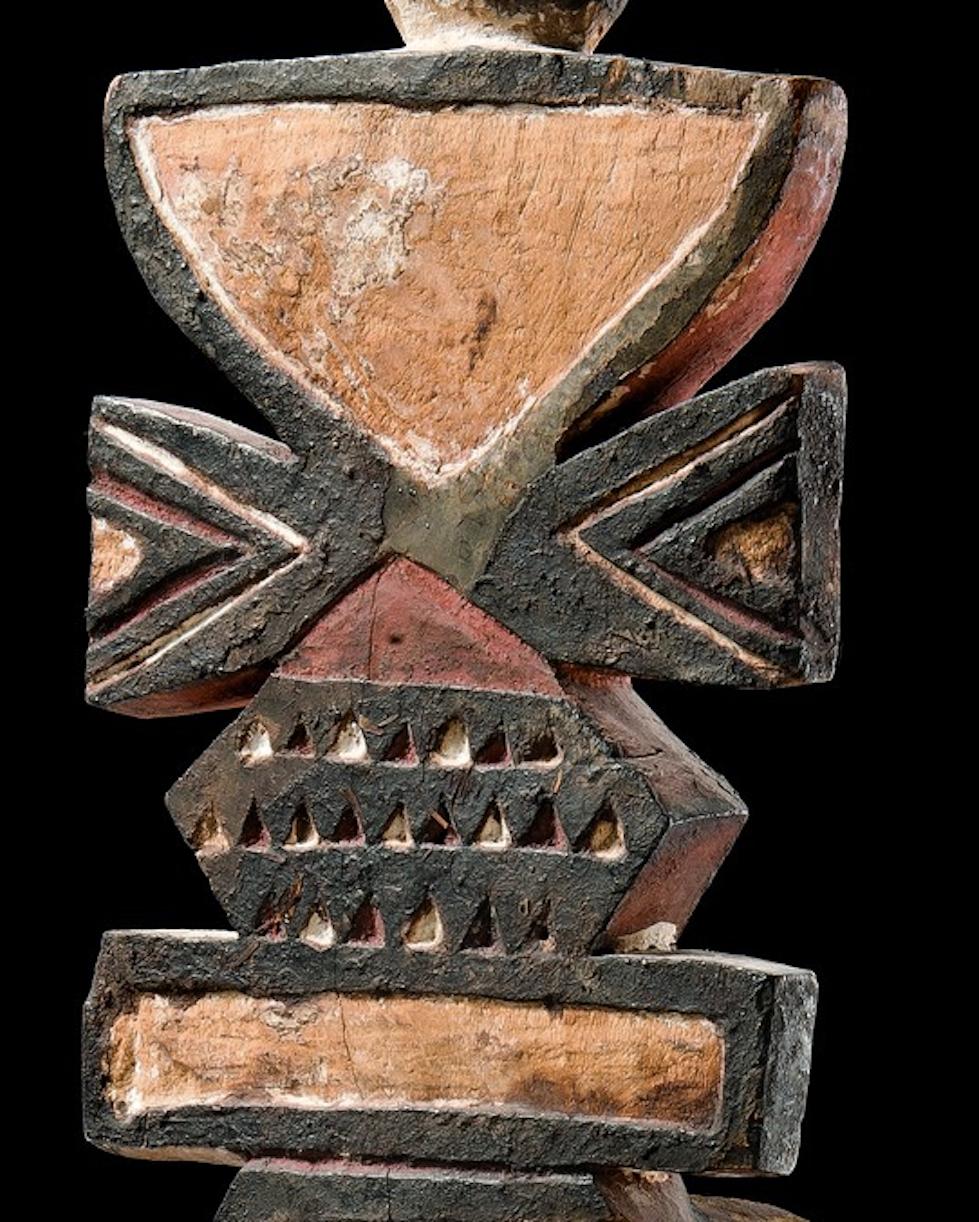 Wooden mask used in ancient ceremonies. A large beak like shape and the piercing black eyes give us the idea that the purpose of the mask was to represent a bird. The zoomorphic representation is crowned with a board-shaped superstructure with