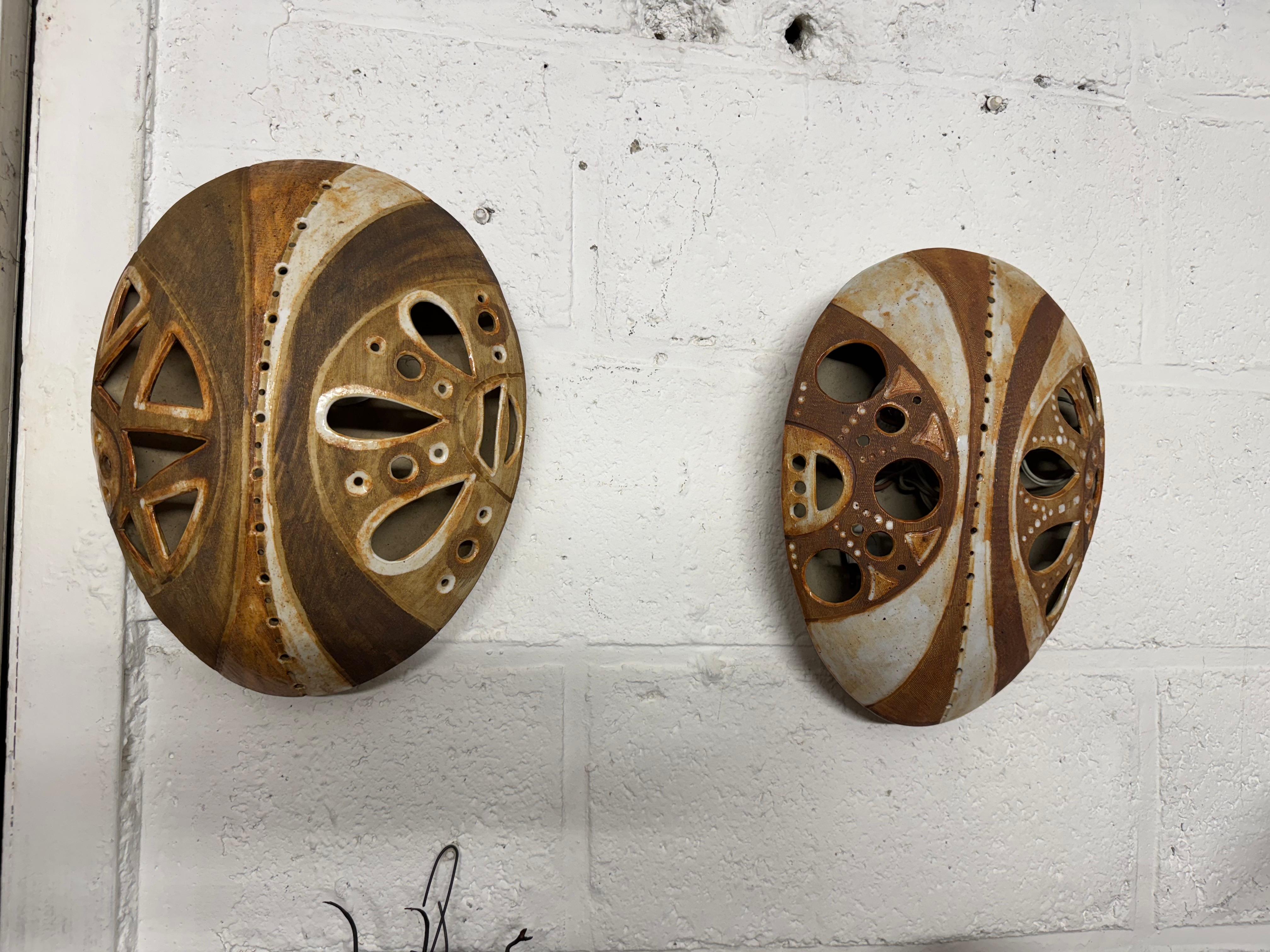 Modern Africanist ceramic pair of sconces For Sale