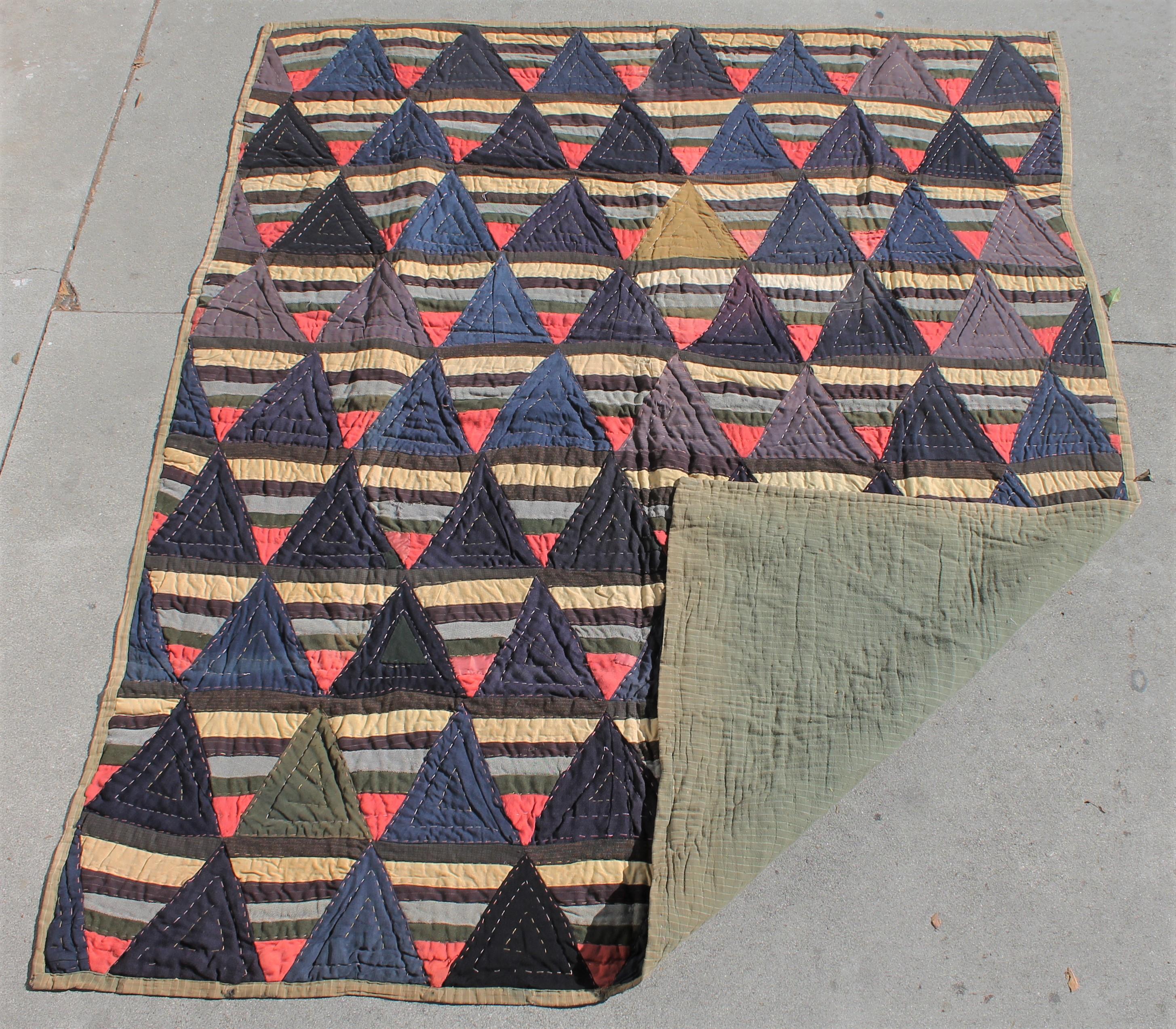 Afro American wool strips quilt. The pattern is roman stripes. This is a folk art quilt with rough quilting and is a crude quilt with crude piecing. Typical of an Afro American Quilt.