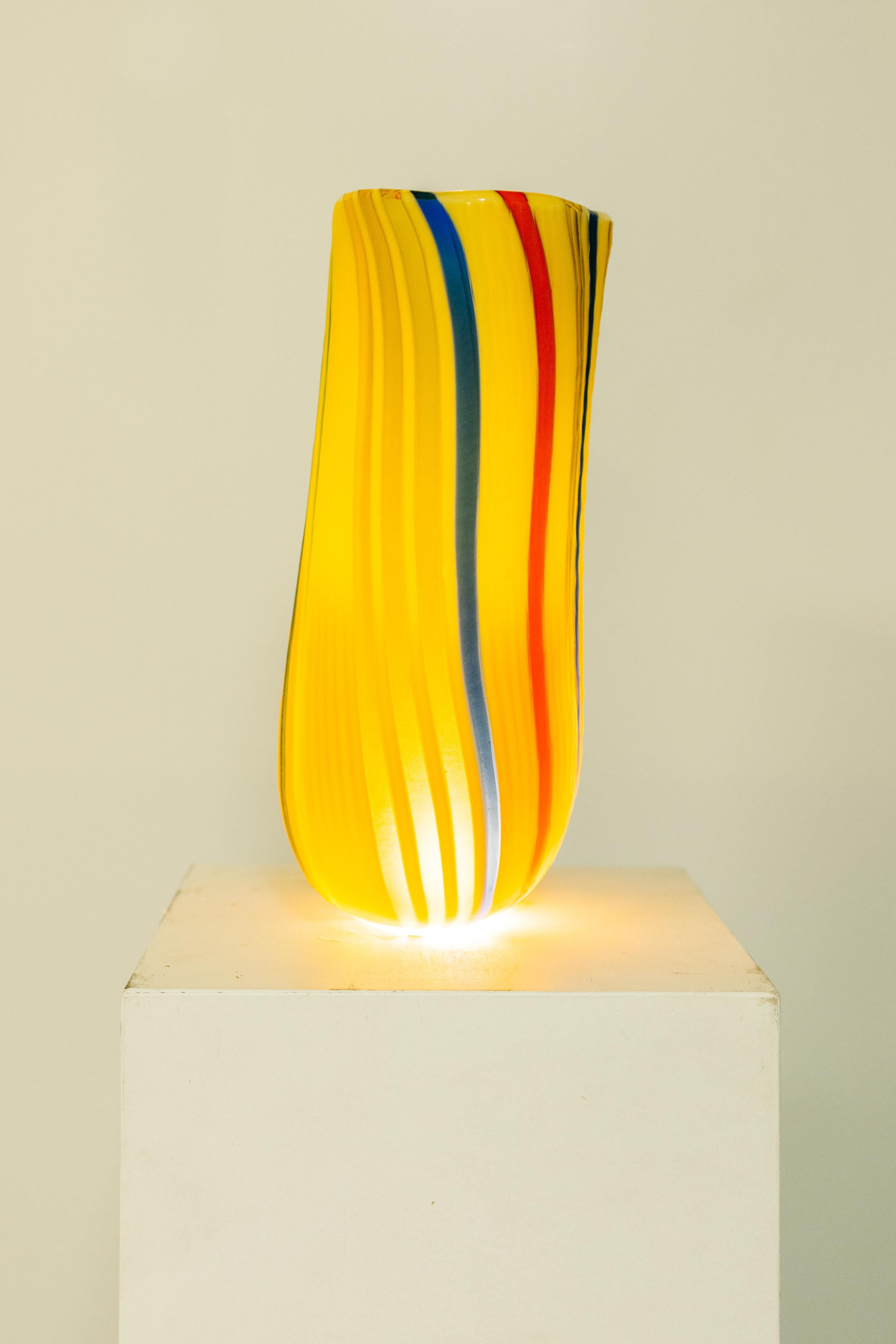 Murano glass blown in Venice by Afro Celotto. Afro Celotto is an Italian glass artist known for his intricate and colorful glass sculptures. He was born in Murano, Italy in 1963, and he comes from a family of glassmakers who have been working in the