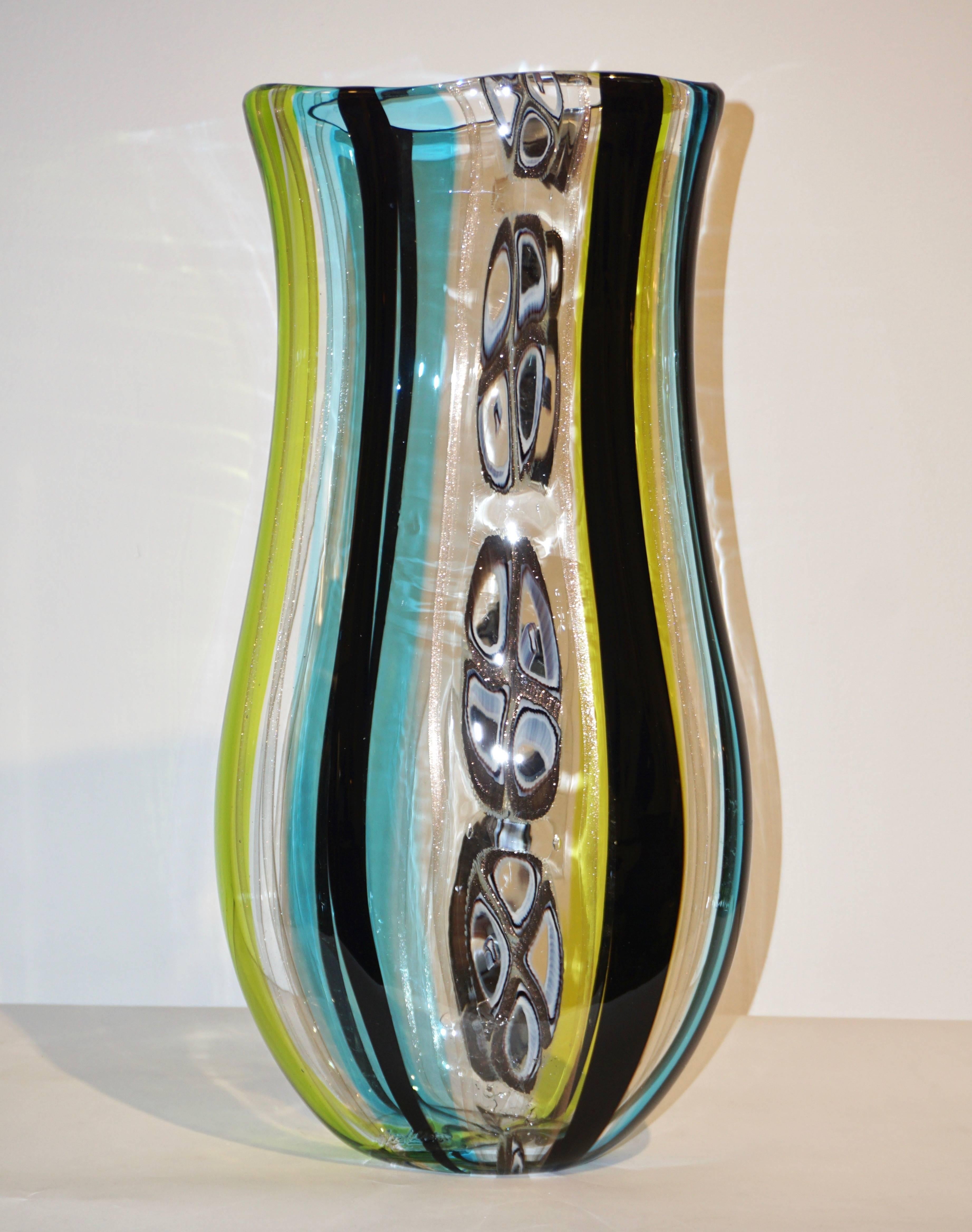 A very elegant grand Murano Art glass vase by Afro Celotto, signed. This Italian organic work of Art of fine design is extensively worked with various difficult techniques and avventurina inclusions (copper in the glass) that gives a precious glow