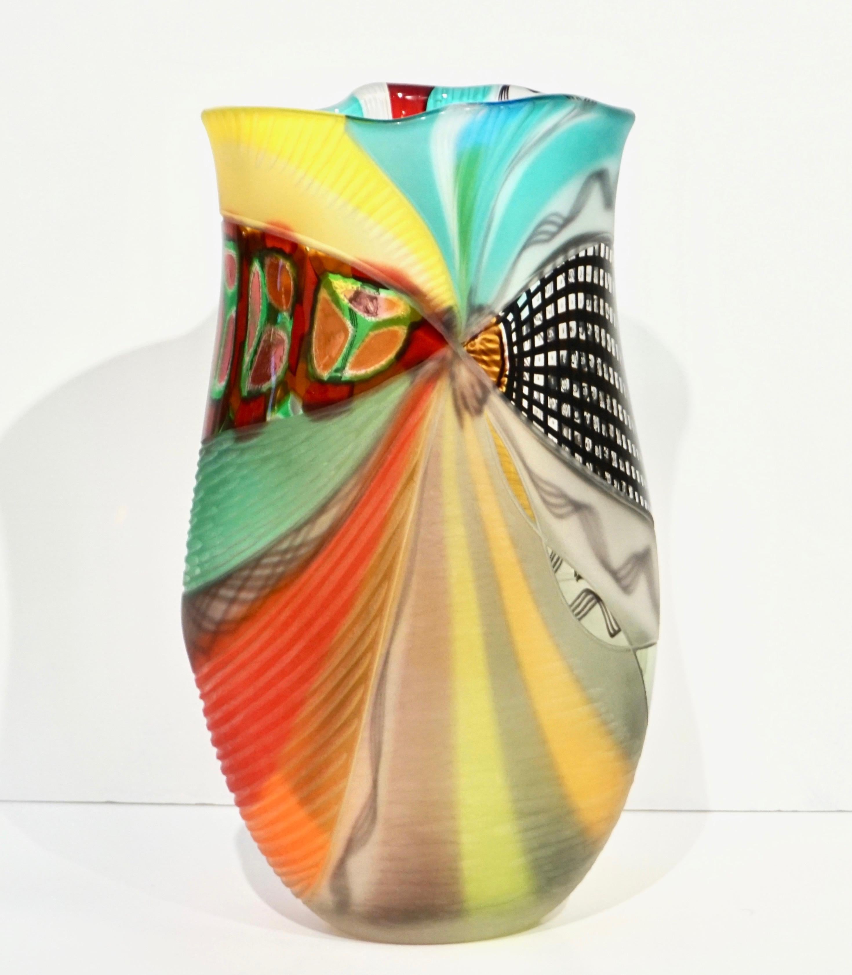 Early 2000s Murano glass vase, by Afro Celotto, worked as an abstract modern painting, with waved edge that adds movement, made precious by the use of several difficult techniques like avventurina, filigrana, reticello... in vibrant colors, red,