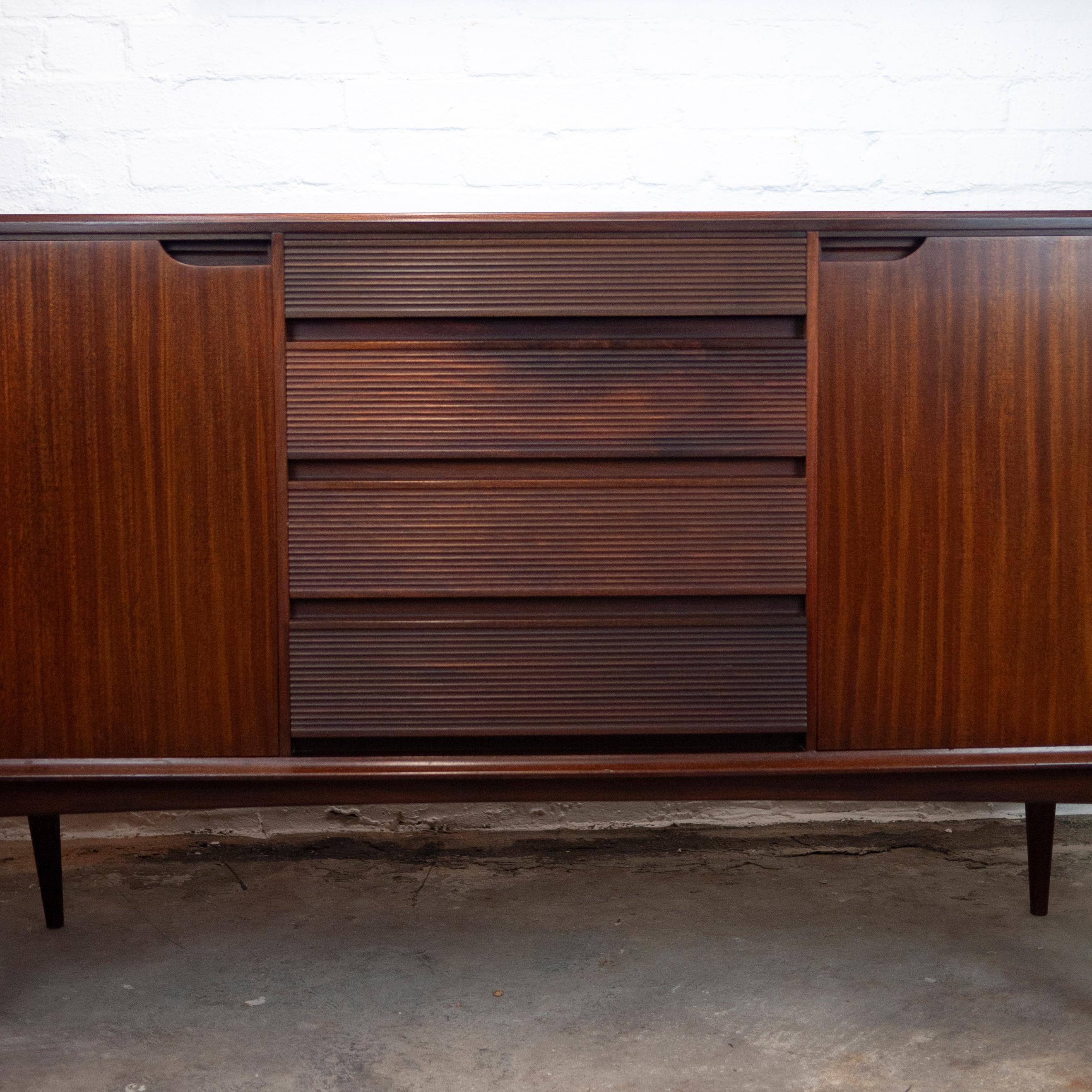 A vintage afromosia sideboard by Richard Hornby. The sideboard features 4 centre drawers and two side cupboards.

Designer - Richard Hornby

Manufacturer - Fyne Ladye Furniture

Design Period - 1960 to 1969

Country of Manufacture -