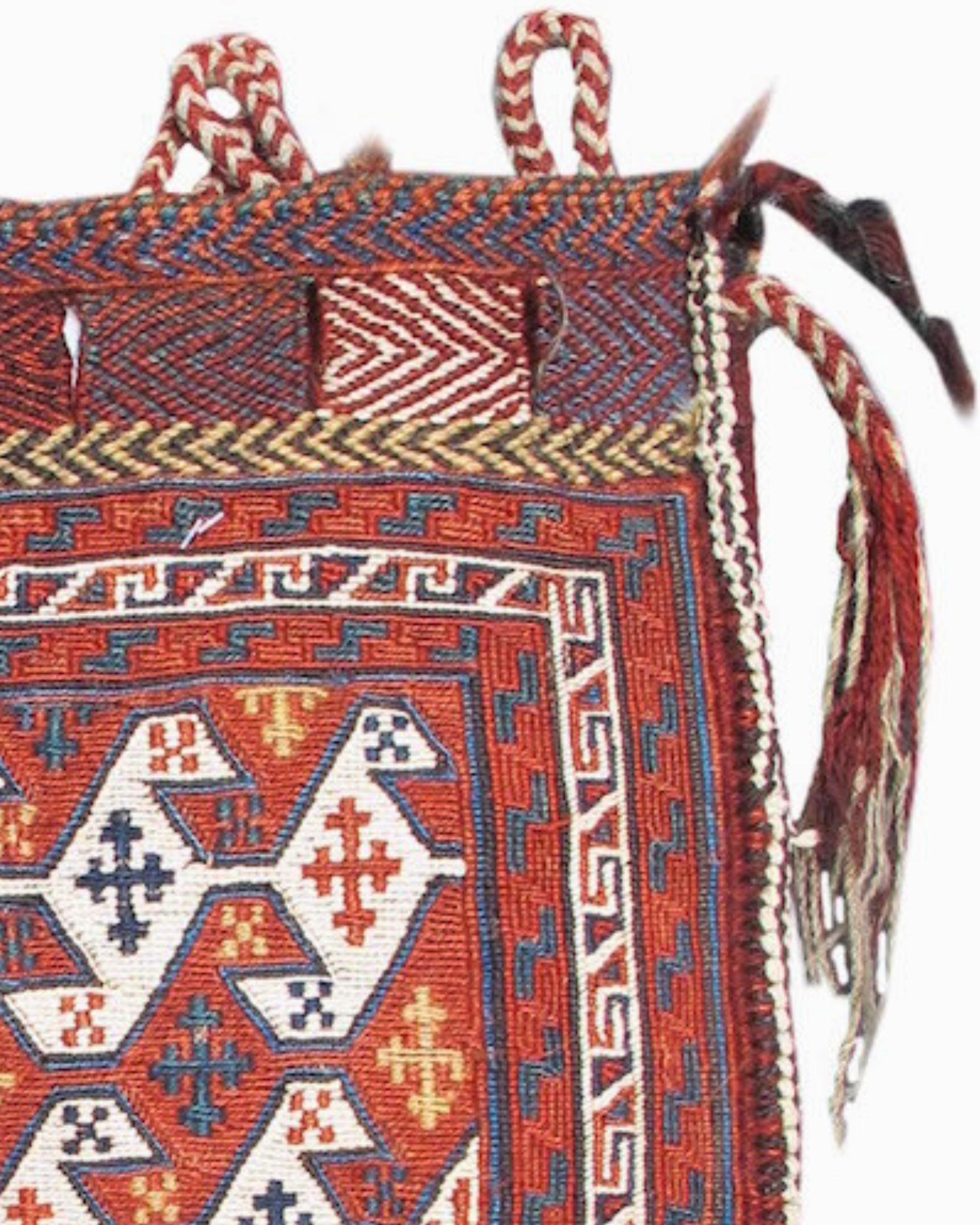 Afshar sumak Bag, Late 19th Century

Creating a distinct sense of motion, reciprocal bands of ïsirga, a linked-pinwheel motif, cross the field of this Afshar sumak. The cotton white provides a distinct contrast when paired with the madder-red wool,