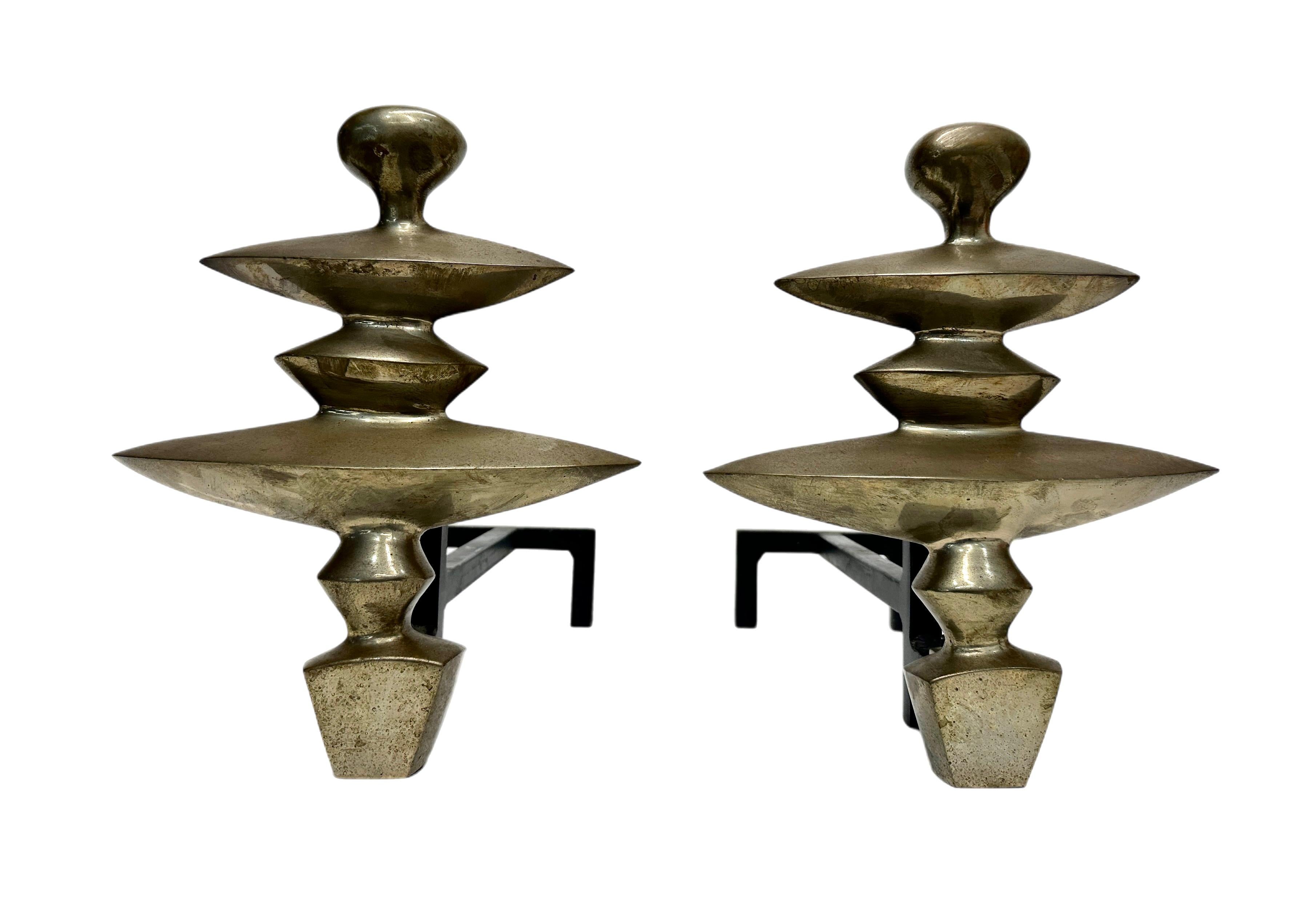 Alberto Giacometti bronze and iron andirons. Based on the 1930's design from the Nelson Rockefeller Collection. These were probably from one of the small editions produced by Excalibur Bronze in the late 1970's, unsigned. 
 We acquired them from