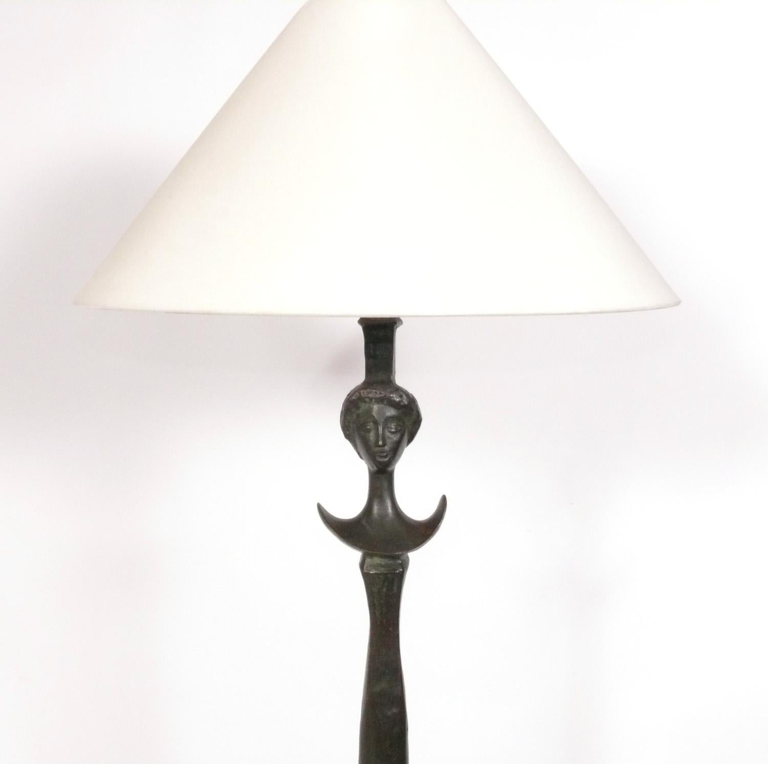 Sculptural Solid Bronze Floor Tete de Femme Model Floor Lamp, originally designed by Alberto Giacometti, circa 1934, this example is probably an unauthorized recast from the 1990s. It retains it's warm original patina and at $2600 vs. the current