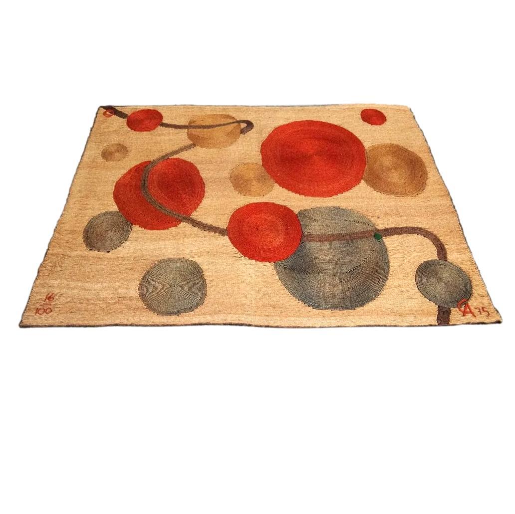 Extremely rare Alexander Calder jute tapestry made in 1975. Signed CA, 75 on bottom right. This tapestry is called 'Untitled' Image resembles a solar system display with yellow, blue and red circles of varying sizes spread throughout the tapestry