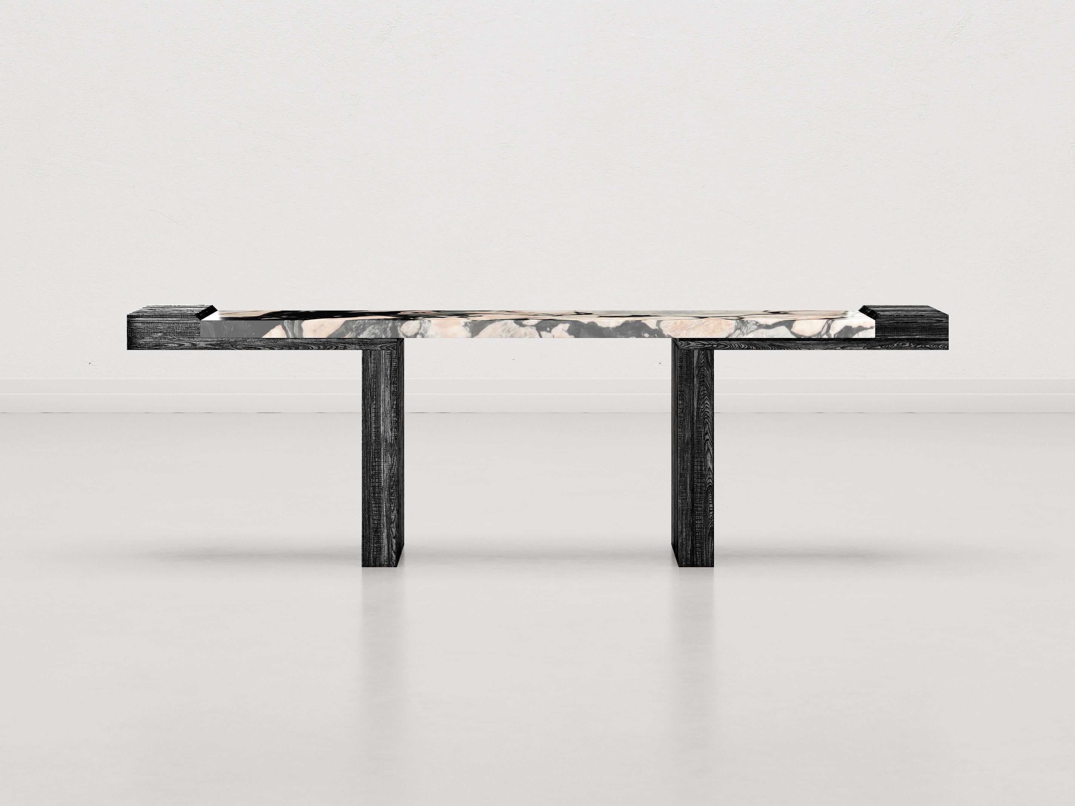The Consolle After All is characterized by the material becoming more predominant than ever, the shape is neutral. The raw, untreated river fir is paired with Notre Dame marble-a material in its natural state-which is full of inclusions and veins