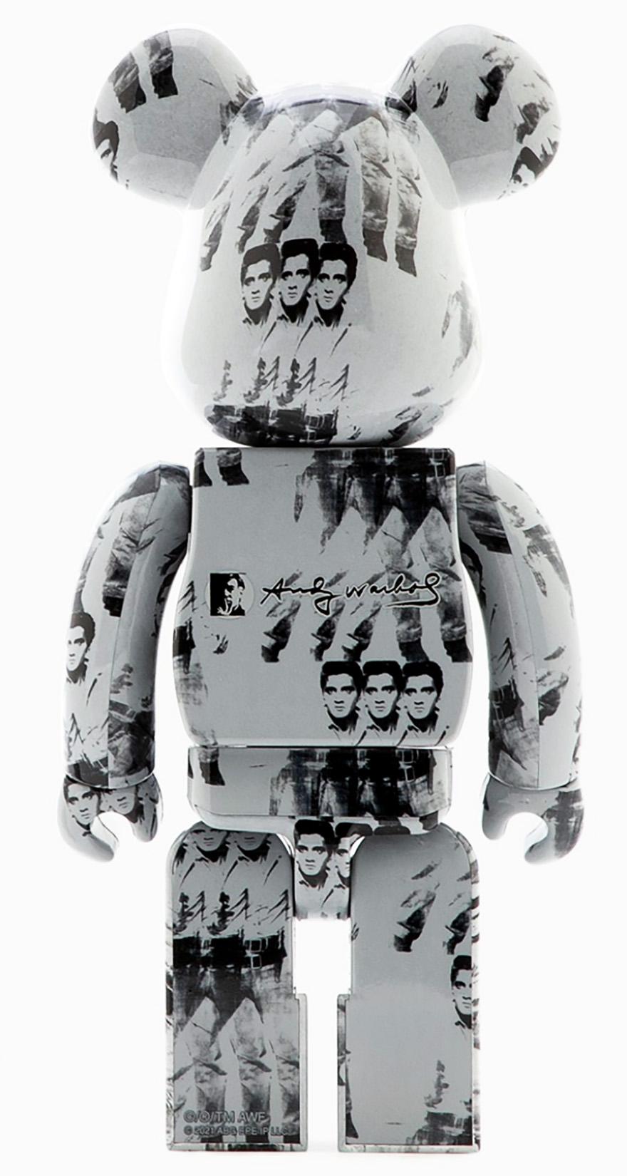 Andy Warhol Elvis Bearbrick Vinyl Figures: Set of two (400% & 100%):
A unique, timeless Andy Warhol Elvis collectible trademarked & licensed by the Estate of Andy Warhol. The partnered collectible reveals Warhol's iconic Triple Elvis wrapping the
