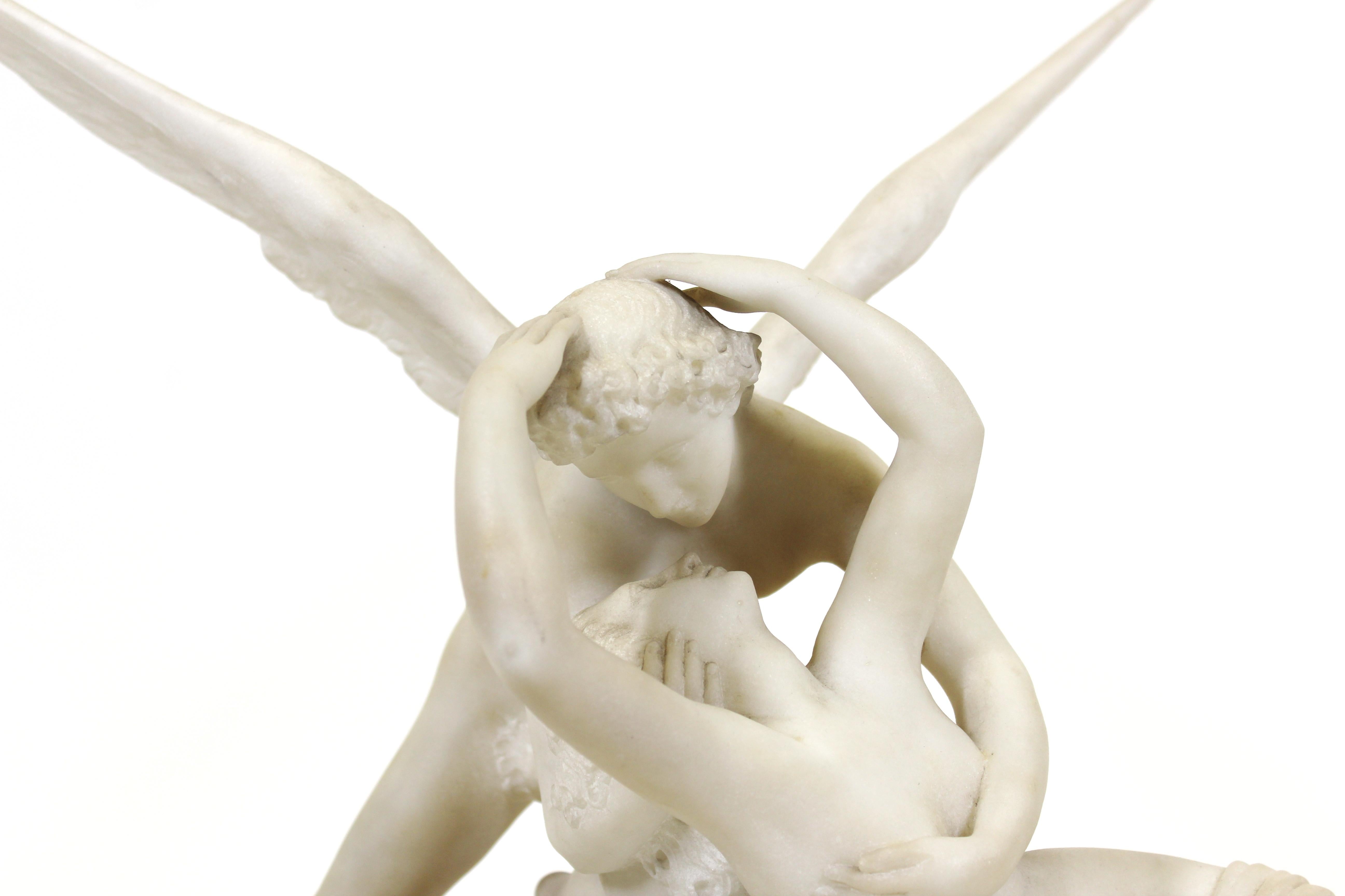After Antonio Canova Italian Grand Tour carved marble copy of 'Cupid & Psyche' on marble base. The piece has detachable wings.