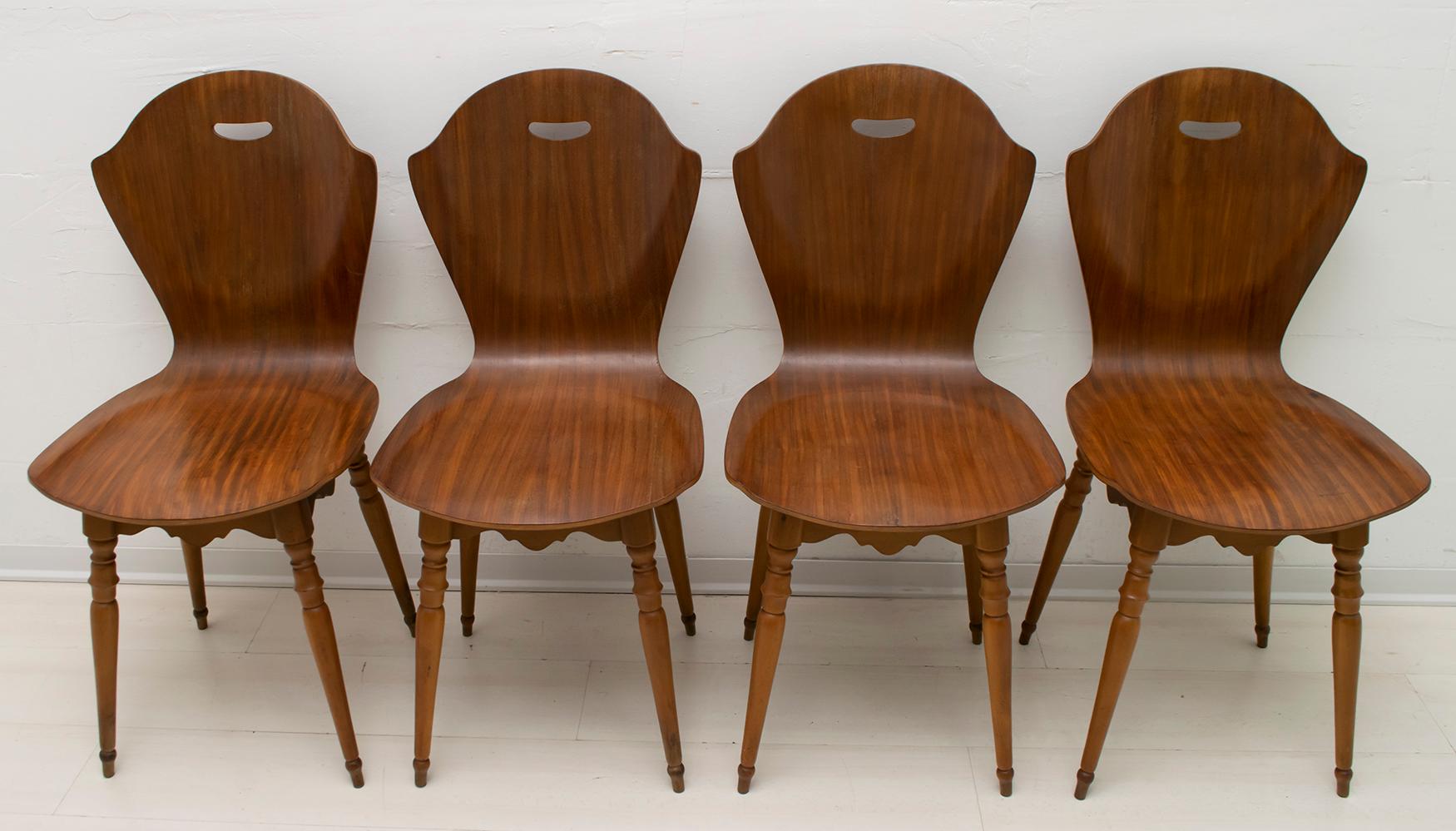 Four original chairs in curved multilayer teak and beech wood, mid-century Italian design in the Carlo Ratti style.