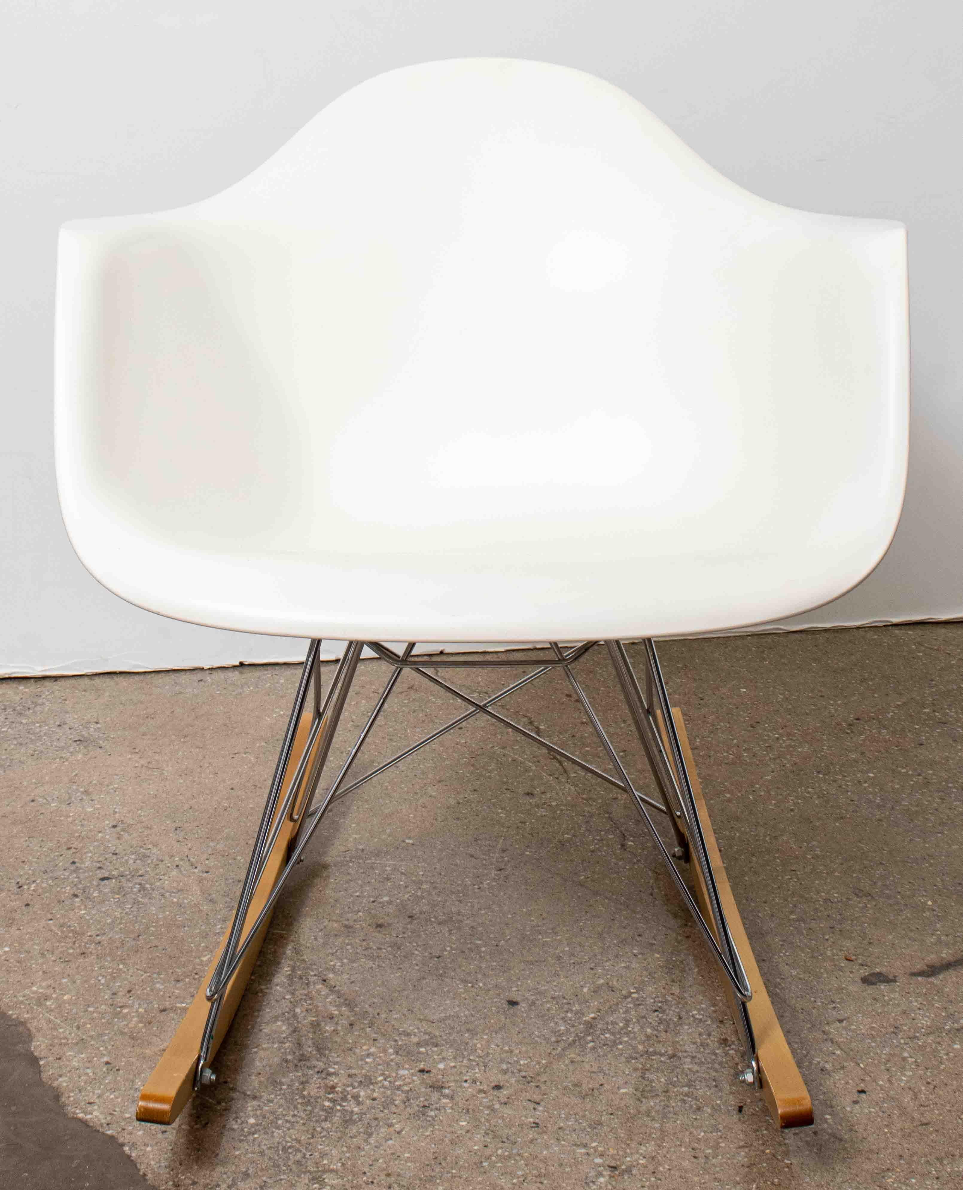 After Charles & Ray Eames for Herman Miller Mid-Century Modern 'RAR' rocker chair, Vitra makers mark on bottom. Measures: 27