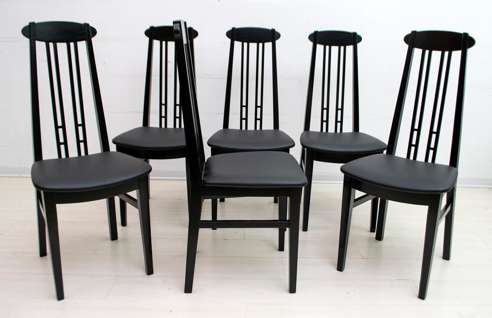 In the style of the Scottish architect Charles Rennie Mackintosh. These six chairs, solidly built in black lacquered ashwood, with black leather upholstery, late 1970s.