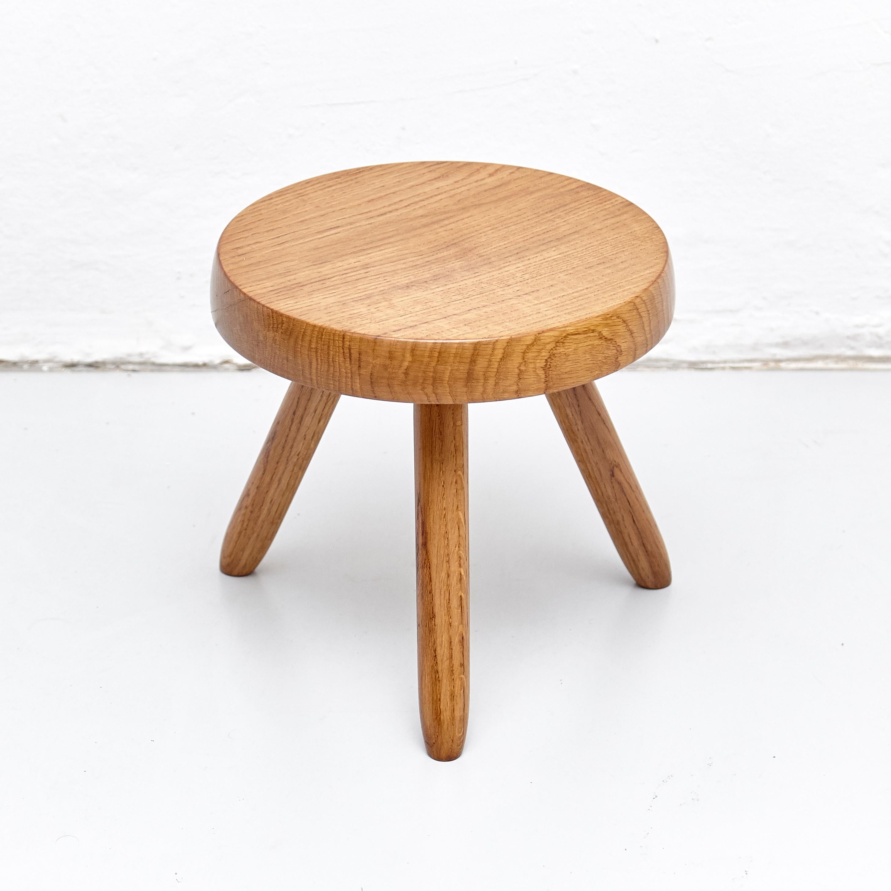 Stool designed in the style of Charlotte Perriand.
Made by unknown manufacturer.

We offer free worldwide shipping for this piece.

In good original condition, preserving a beautiful patina, with minor wear consistent with age and use.