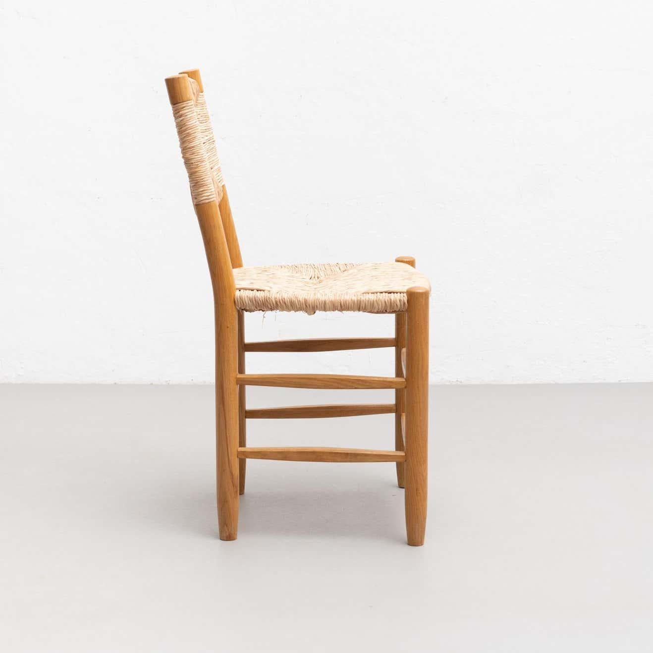 After Charlotte Perriand N.19 Chair, Wood Rattan, Mid-Century Modern In Good Condition For Sale In Barcelona, Barcelona