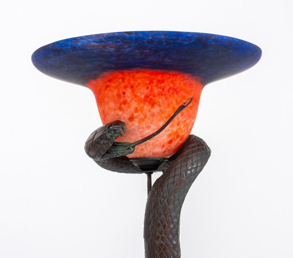 After Edgar Brandt (French, 1880-1960) style cobra lamp, 20th century, with stained glass shade.

Dealer: S138XX