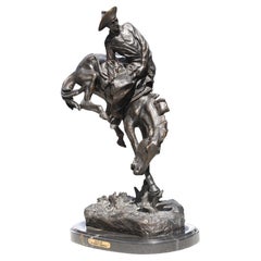 After, Frederic Remington, (American, 1861-1909) Bronze