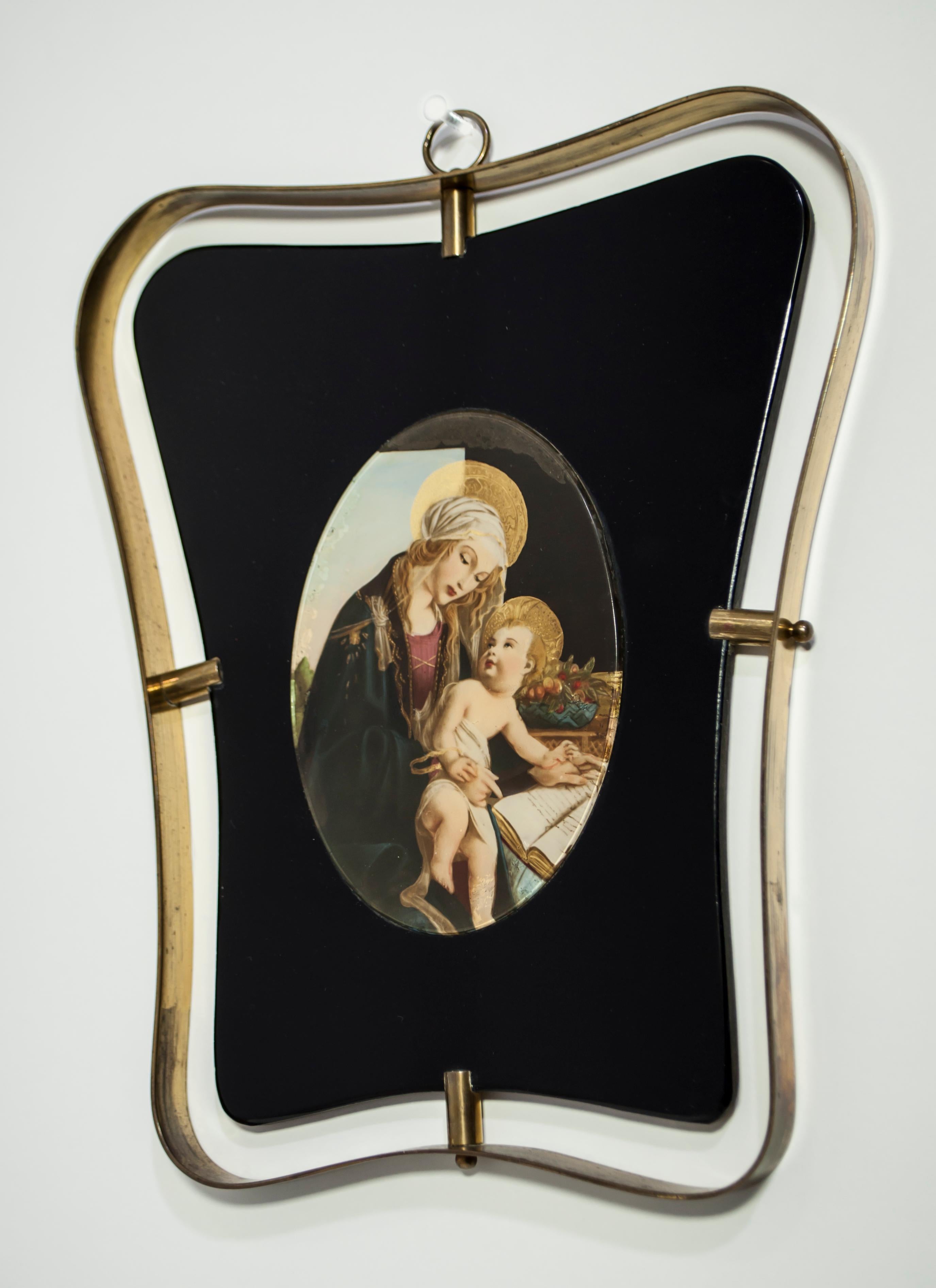 This madonna with child (Capoletto) was made on black crystal and brass frame, in the style of Gio Ponti. Italy, circa 1945s
It is a decal on glass decorated by hand.