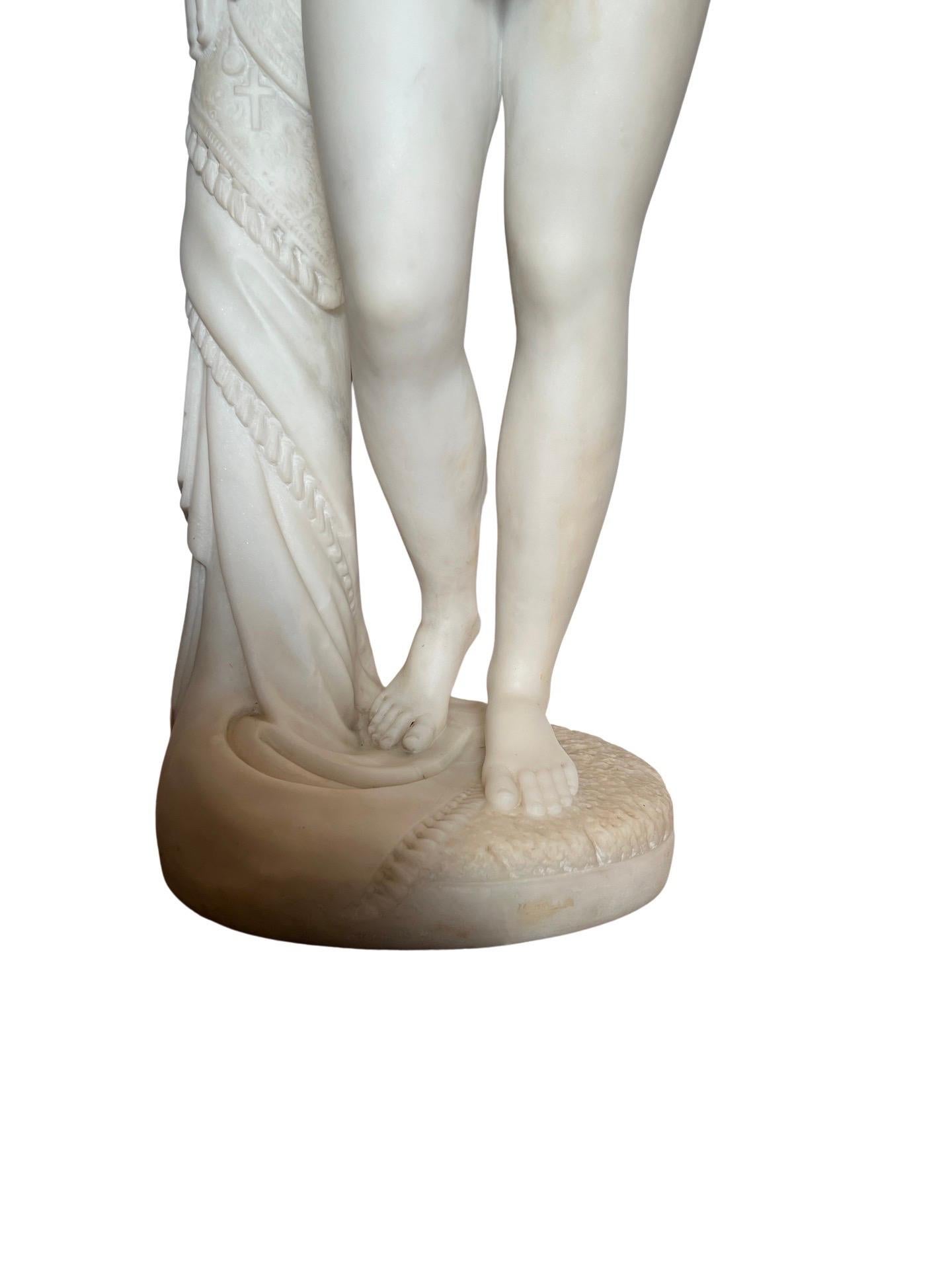 After Hiram Powers (American, 1805-1873), “The Greek Slave”. A finely carved white marble sculpture after the antiquity which is currently held in the collection of Yale University. This model is unsigned but displays excellent quality likely dating