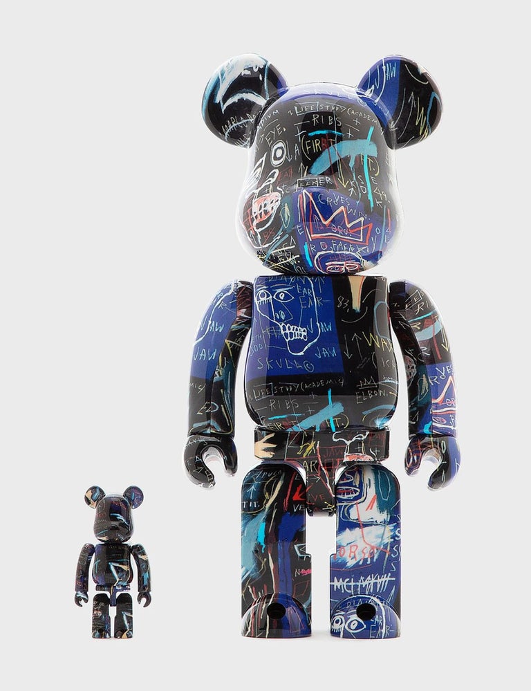 Jean-Michel Basquiat 400% Bearbrick Vinyl Figures Set of 2:
A unique Basquiat Bearbrick statue set trademarked & licensed by the Estate of Jean-Michel Basquiat. The partnered collectibles reveal licensed original iconic 1980s Basquiat imagery
