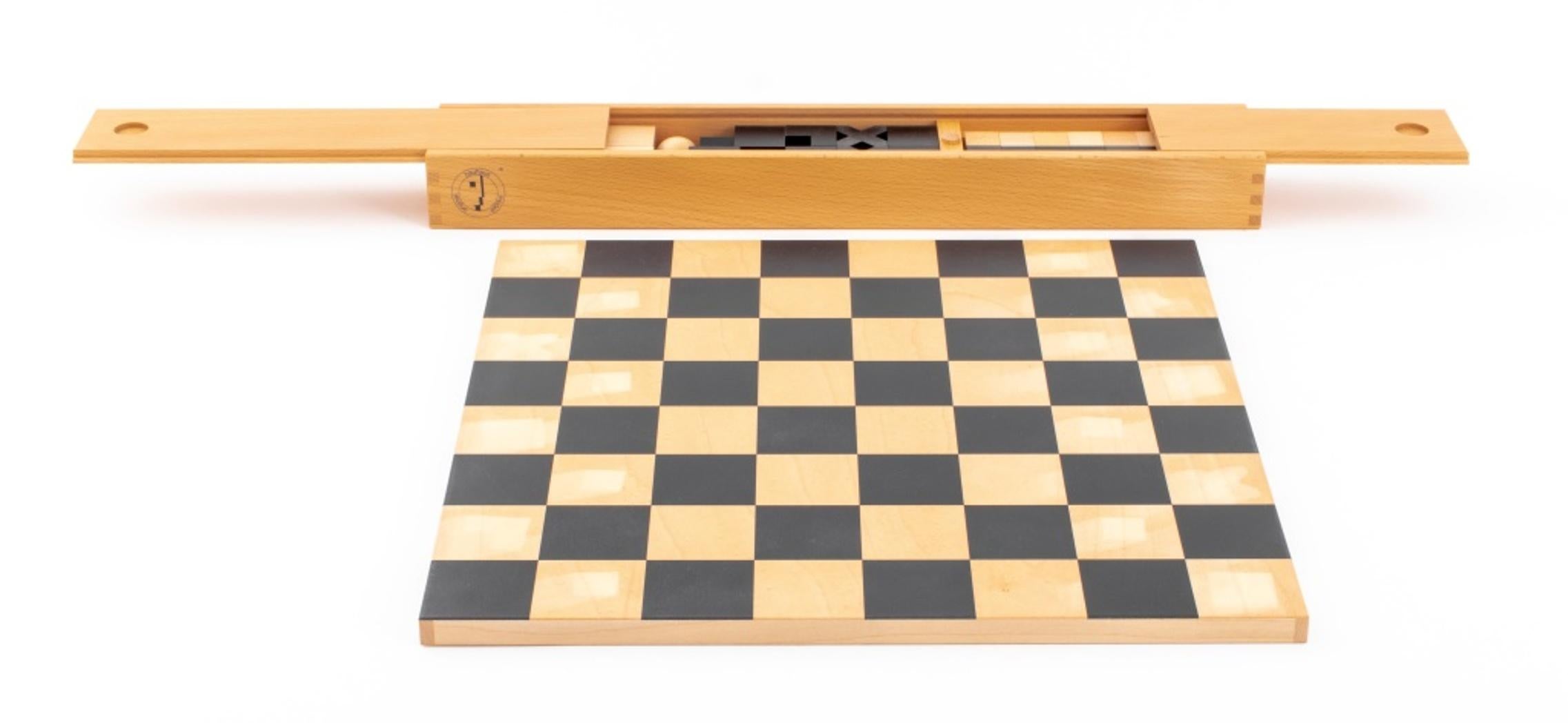 Bauhaus hardwood chess set and board, the Bauhaus-Schachspiel originally designed by Josef Hartwig (German, 1880-1956) in 1923, the geometric pieces housed in a box marked 