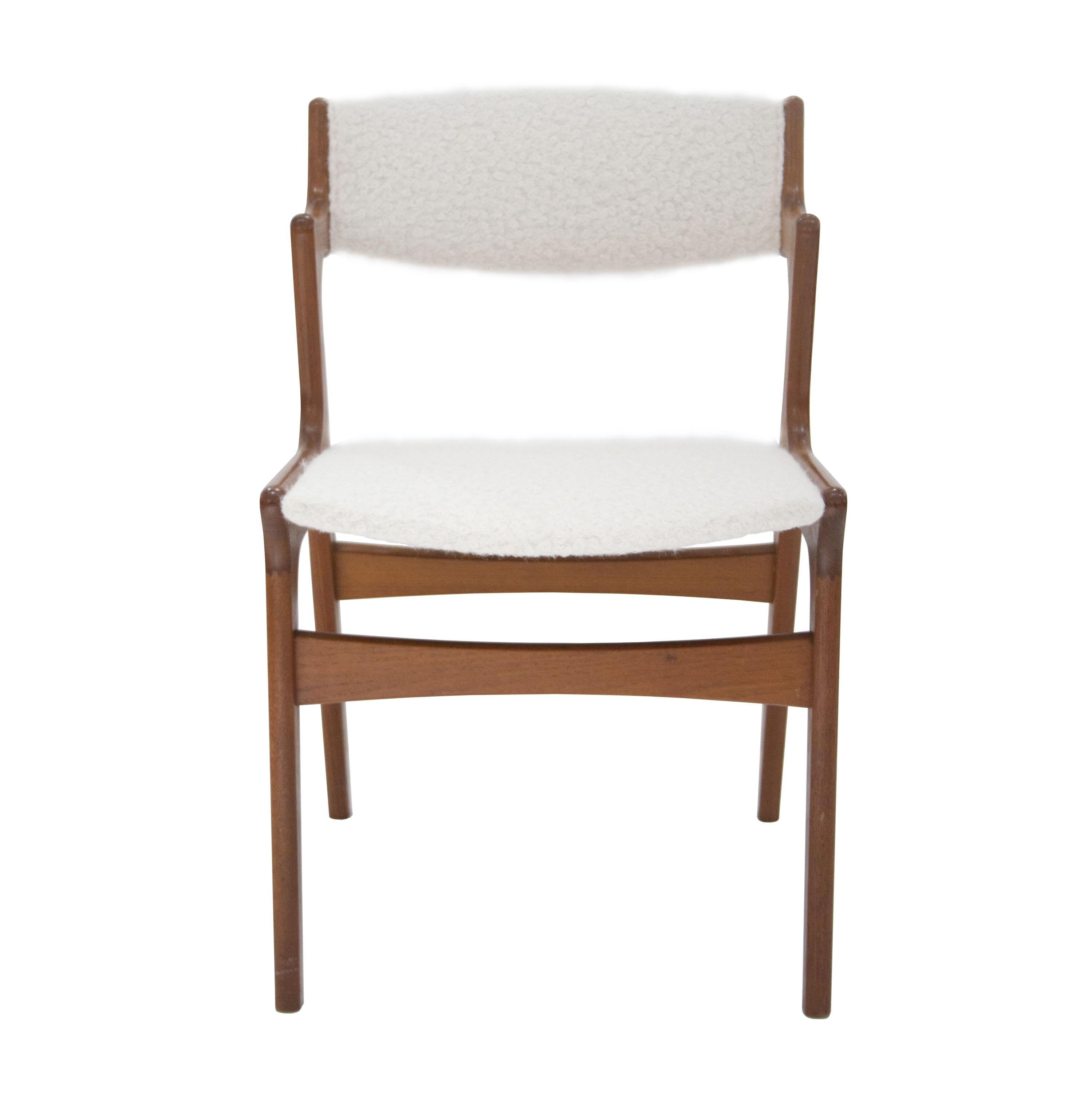 Set of four dining chairs in the style of Kai Kristiansen made of solid teak. Reupholstered in wool bouclé.