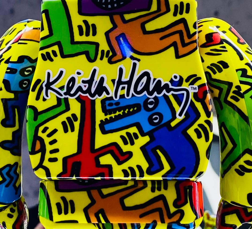 Keith Haring Bearbrick Vinyl Figures: Set of two (400% & 100%):
A unique, timeless collectible trademarked & licensed by the Estate of Keith Haring. The partnered collectible reveals the late iconic artist’s artwork from the mid 1980s wrapping the