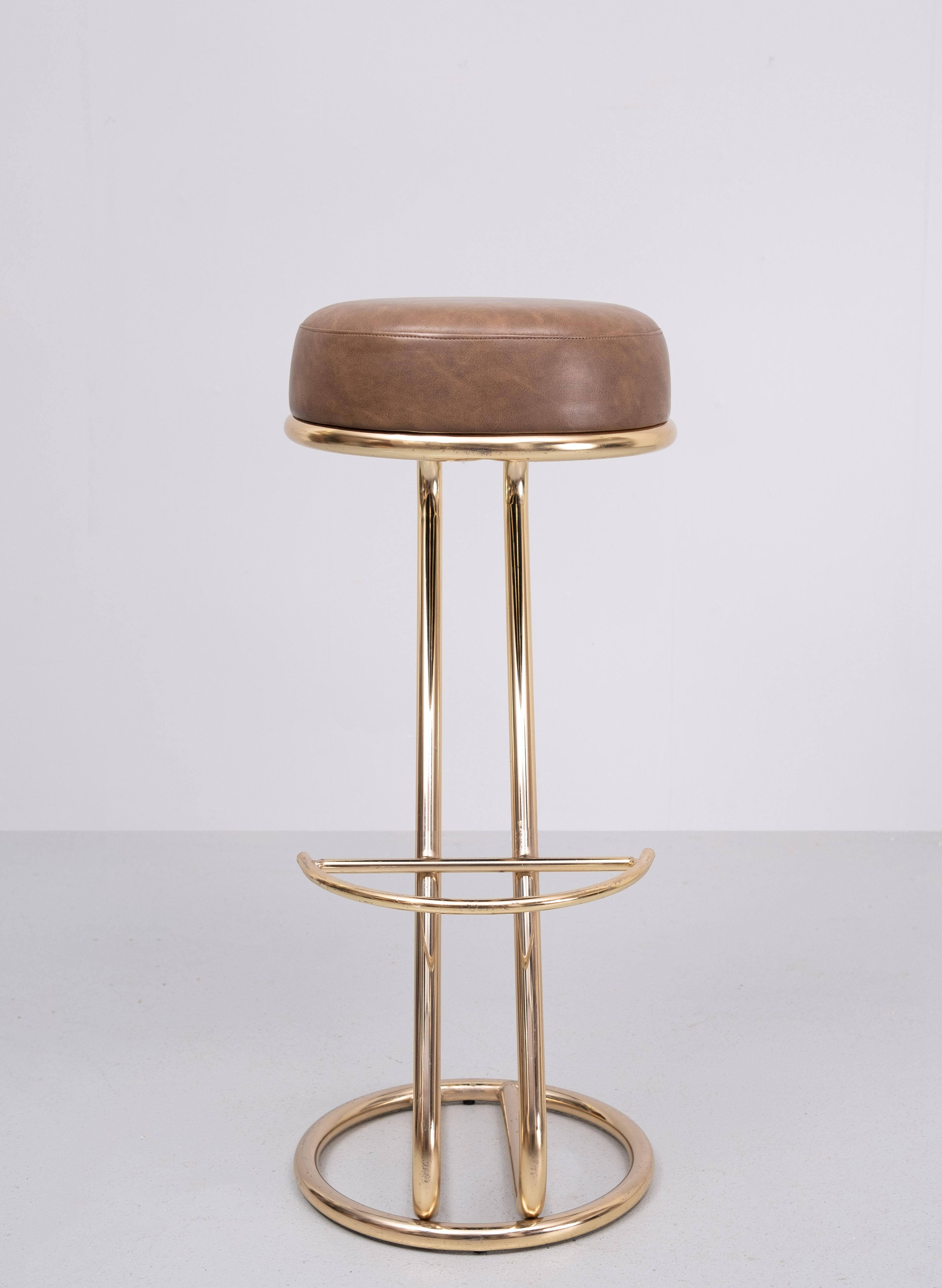 Very nice Brass bar stool .Design after  Louis Sognot  France 
Good looking stool .light Brown color upholstery 
