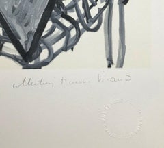 FEMME ASSISE DANS UN FAUTEUIL TRESSE