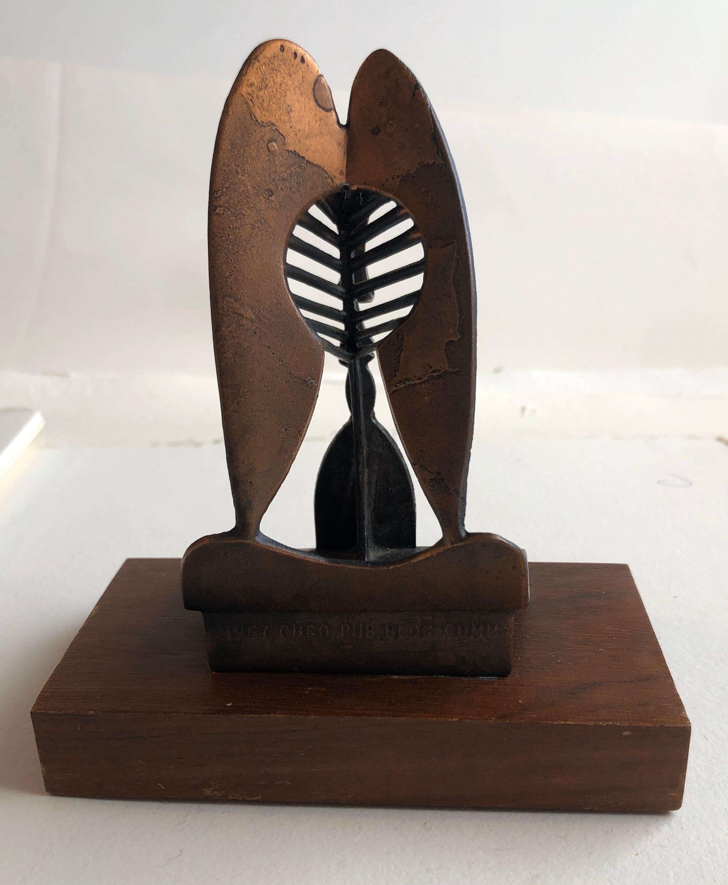 This is a model of the large Picasso sculpture in Chicago it is a vintage piece from 1967 and was made for the Chicago Public Building Commission (I believe by the Chicago replica co.)
there is a copper colored mottled patina to the piece. 

The