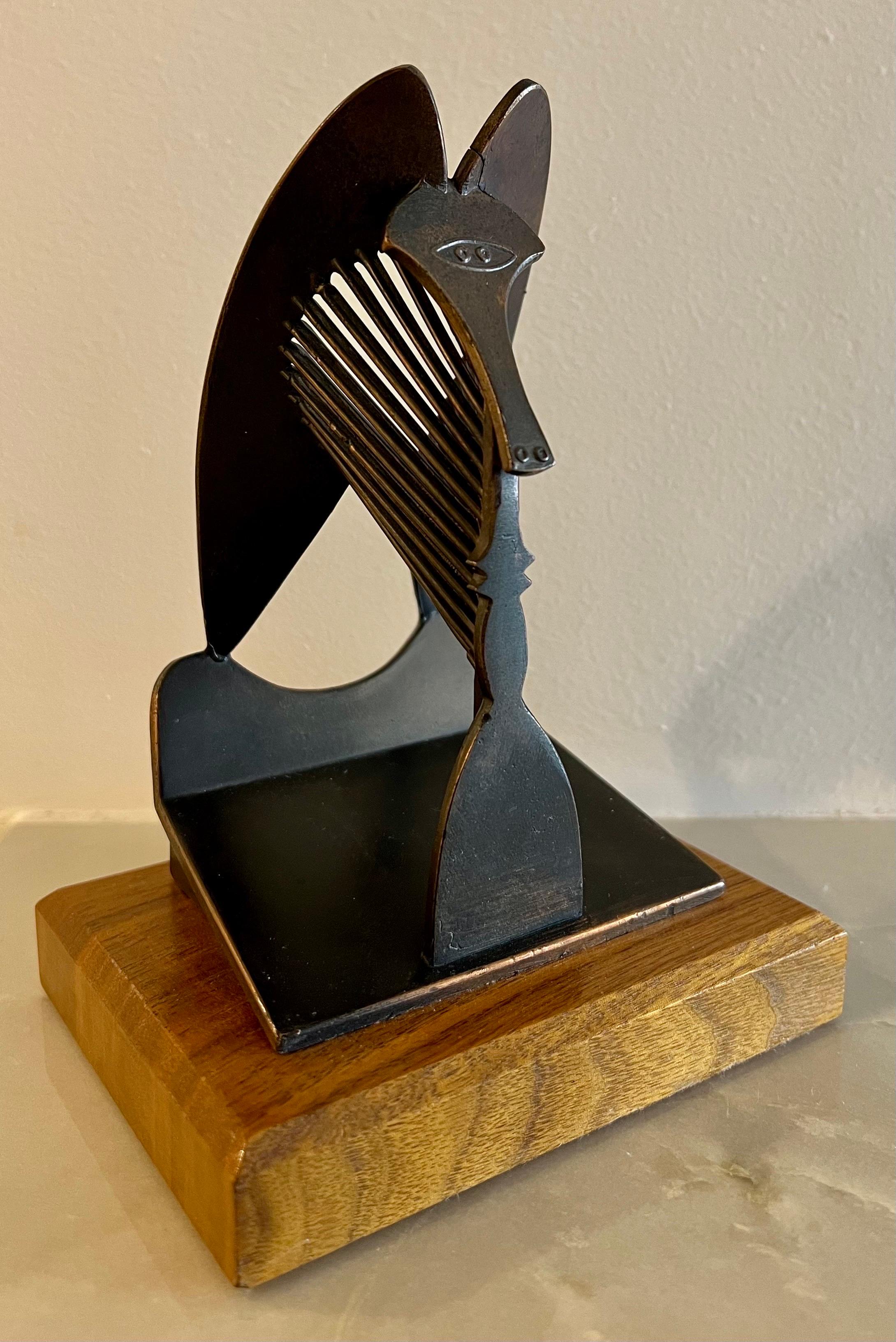 This is a model of the large Picasso sculpture in Chicago it is a vintage piece from 1967 and was made for the Chicago Public Building Commission (I believe by the Chicago replica co.)
there is a bronze colored mottled patina to the piece. Mounted