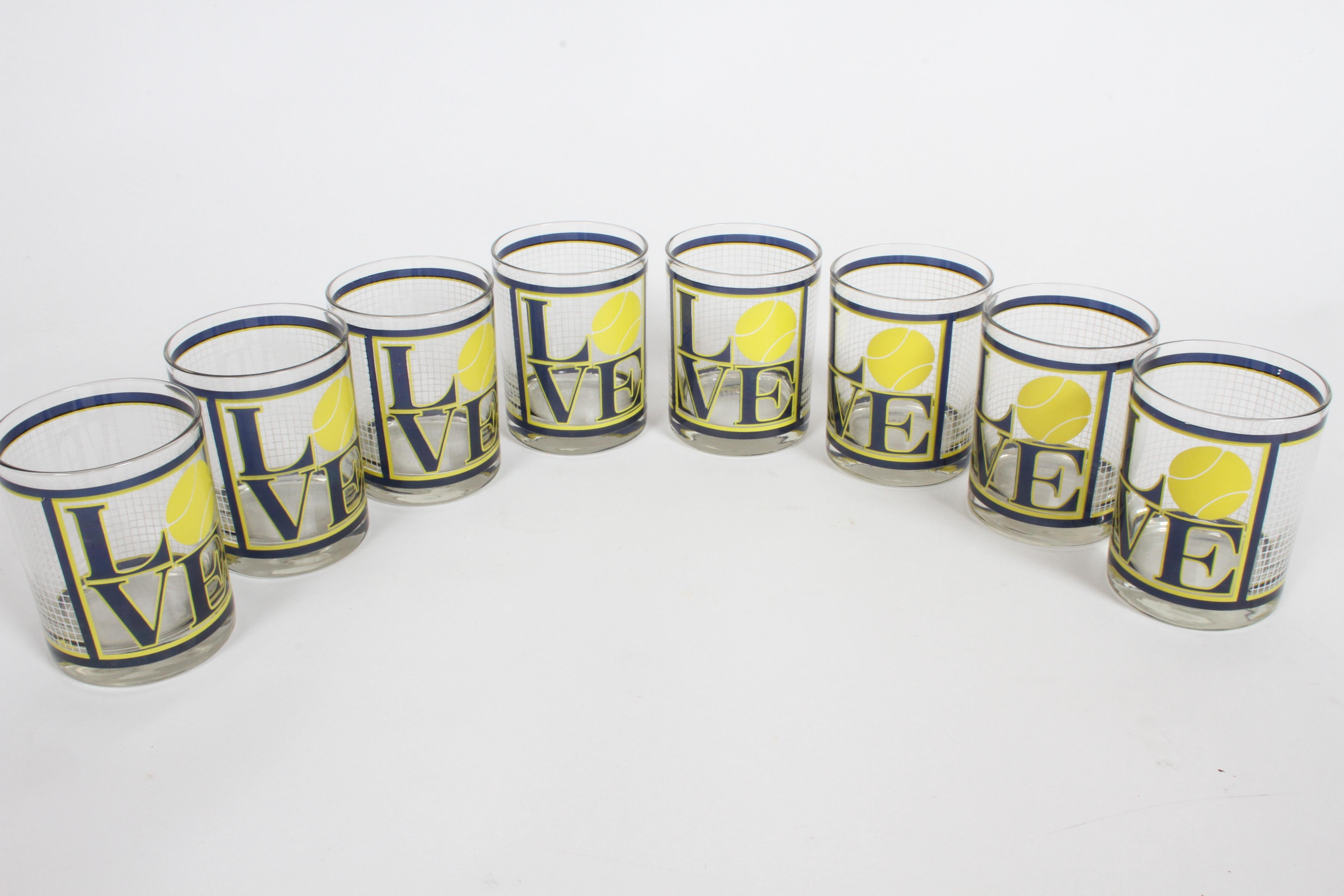 Set of 8 low ball glasses after Robert Indiana's Love design. Manufactured by Cera, glasses have tennis ball inserted in the iconic Love graphic, and grid as the net. Signed Cera. In nice gently used condition, no chips or major wear.