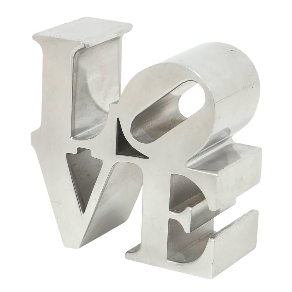 After Robert Indiana love sculpture paperweight polished aluminum chrome nickel, 1970s. Sold at museum gift stores. In good original condition.